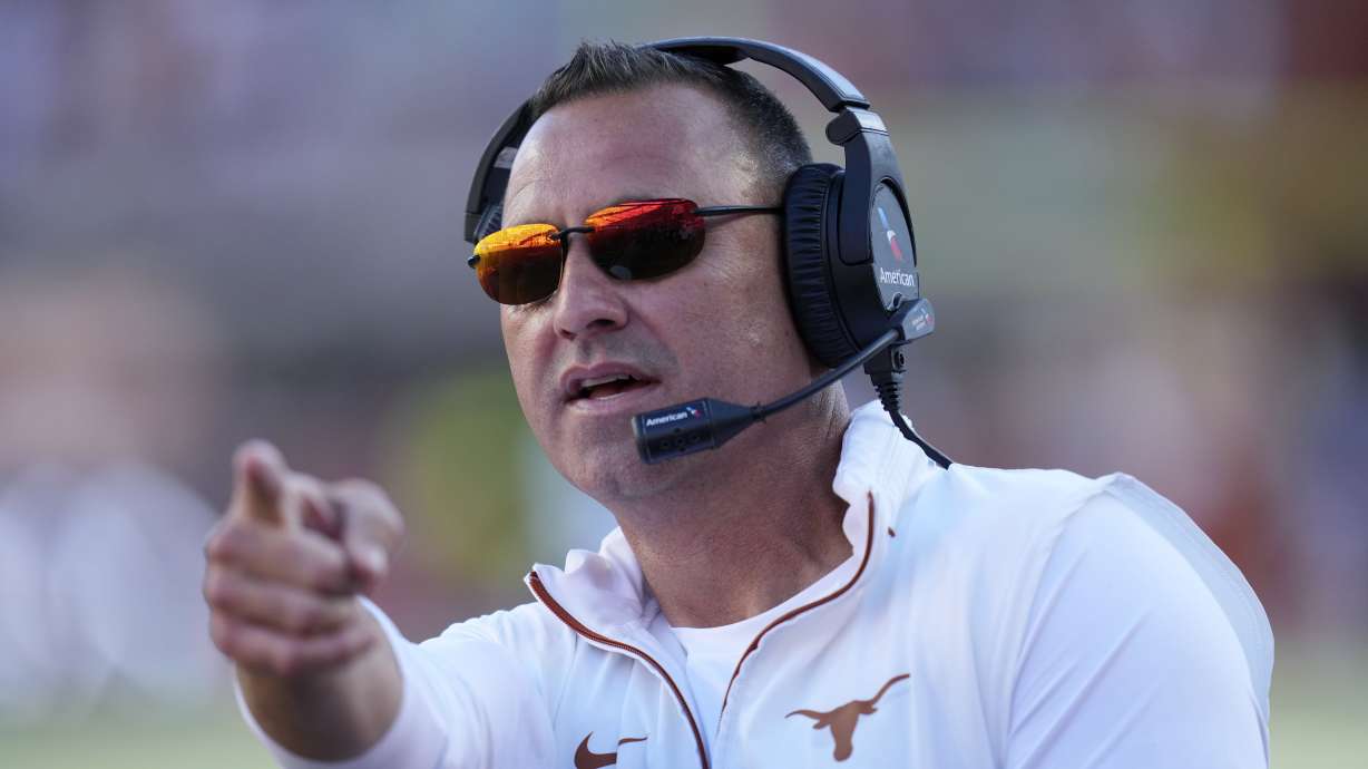 Texas head coach Steve Sarkisian signals during the first half of an NCAA college football game against Kentucky in Austin, Texas, Saturday, Nov. 23, 2024.