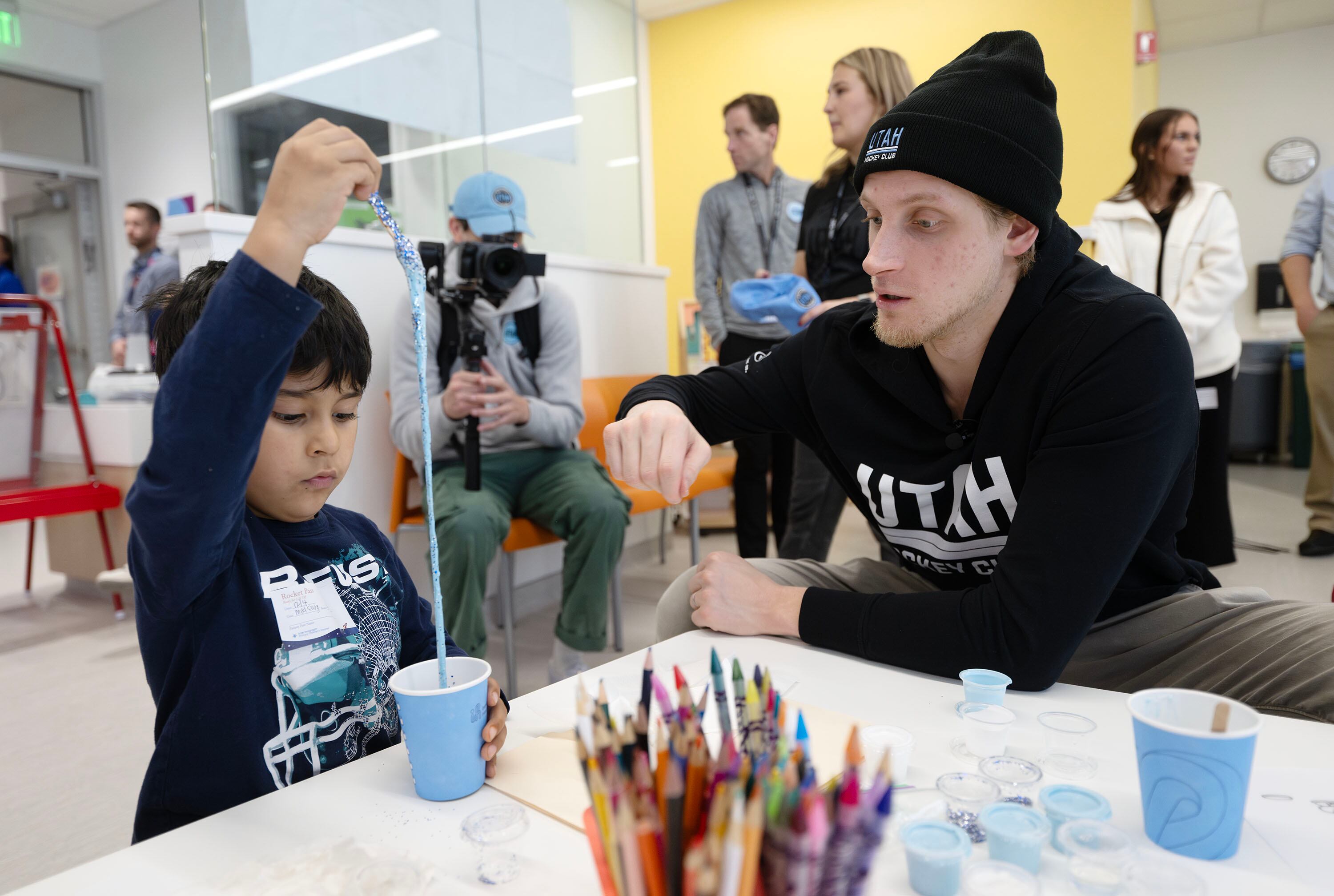 Utah HC defenseman Juuso Välimäki plays with Alejandro Martinez as the two make slime. Members of the Utah Hockey Club visited the kids at Primary Children’s Hospital in Lehi on Wednesday.