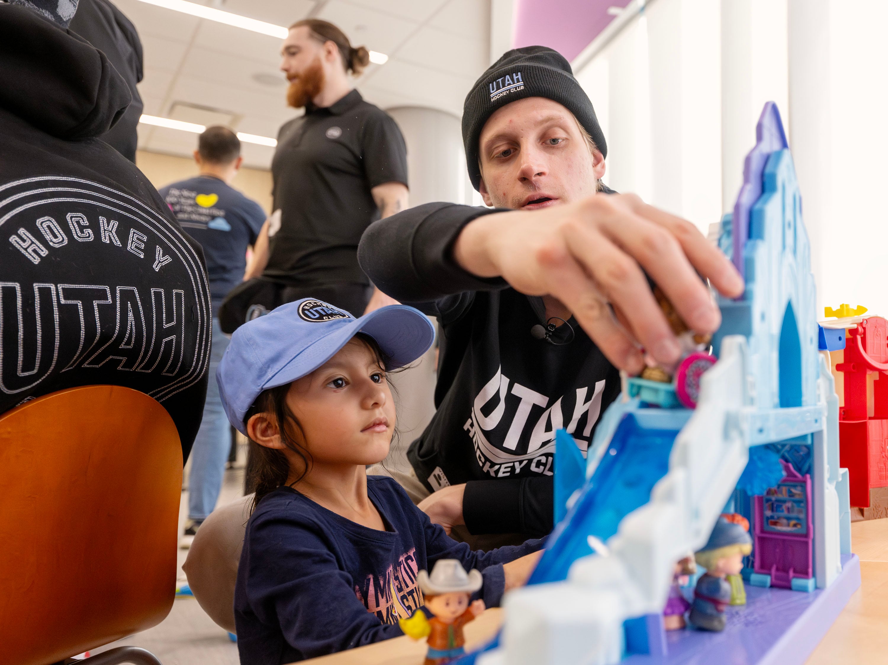 Utah HC defenseman Juuso Välimäki plays Little People with Marvella Perez as members of the Utah Hockey Club visit the kids at Primary Children’s Hospital in Lehi on Wednesday.