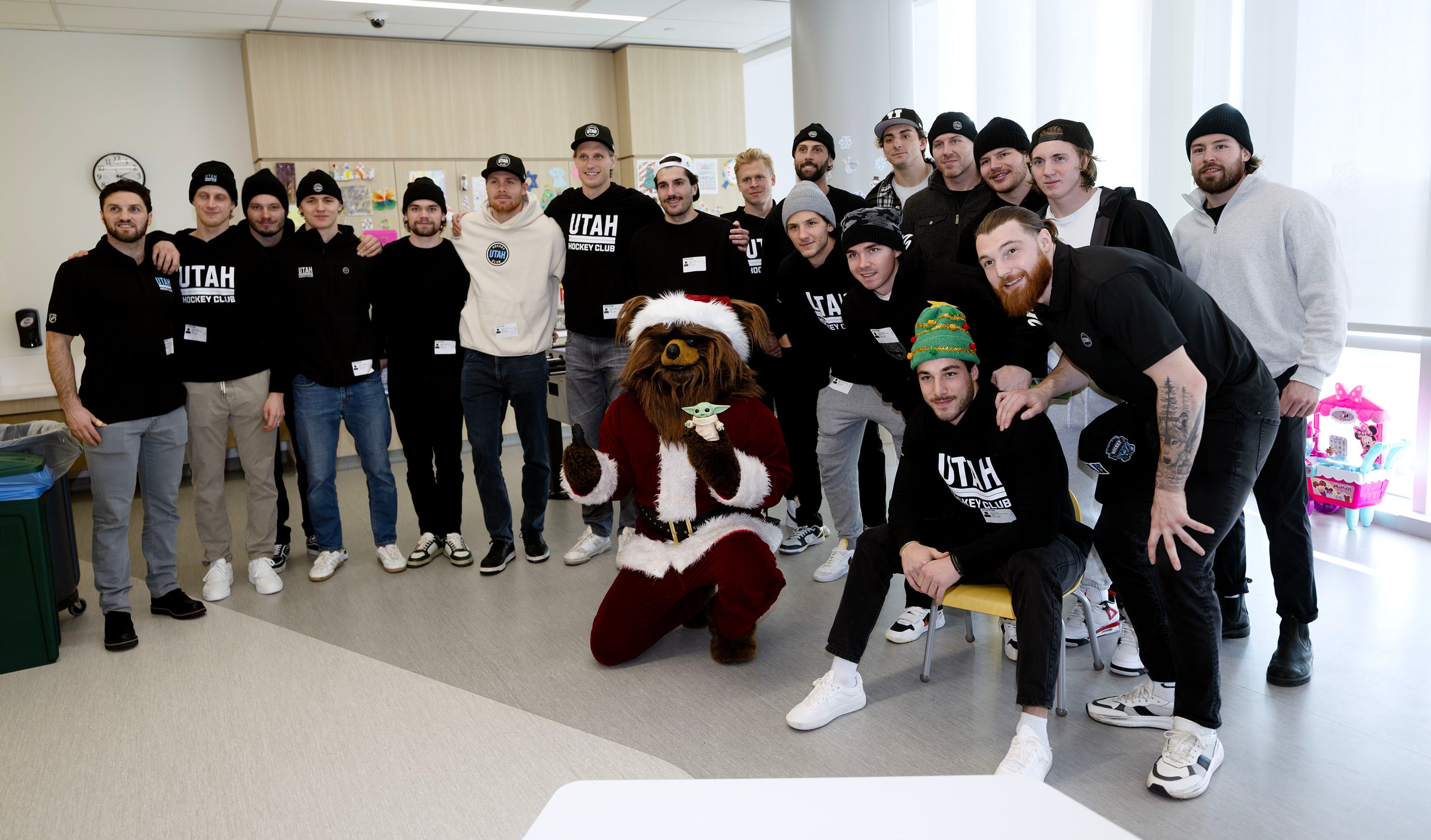 Members of the Utah Hockey Club (joined here by Jazz Bear) visit kids at Primary Children’s Hospital in Lehi on Wednesday.