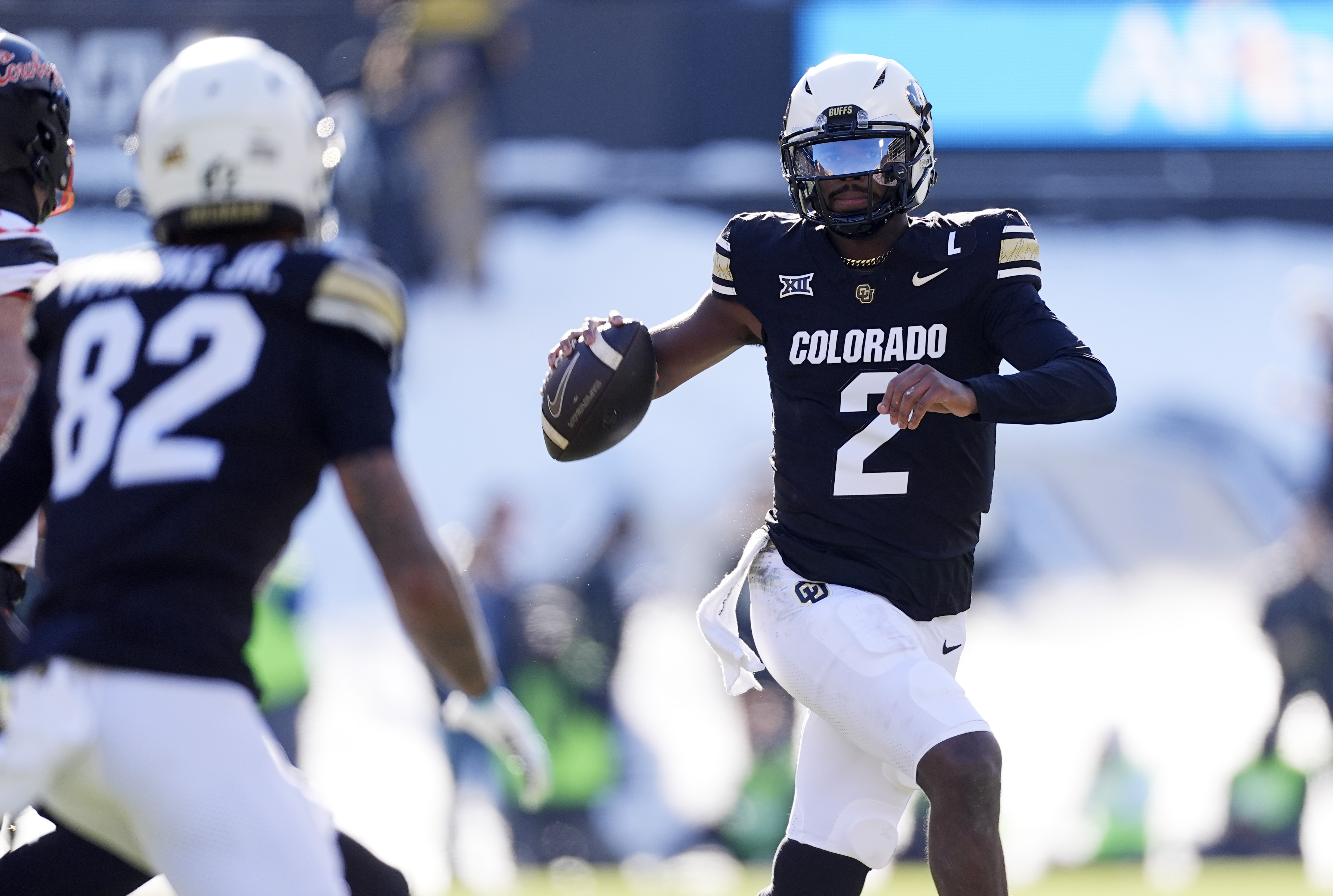 Colorado quarterback Shedeur Sanders looks to pass the ball to wide receiver Terrell Timmons Jr. in the first half of an NCAA college football game against Oklahoma State Friday, Nov. 29, 2024, in Boulder, Colo.