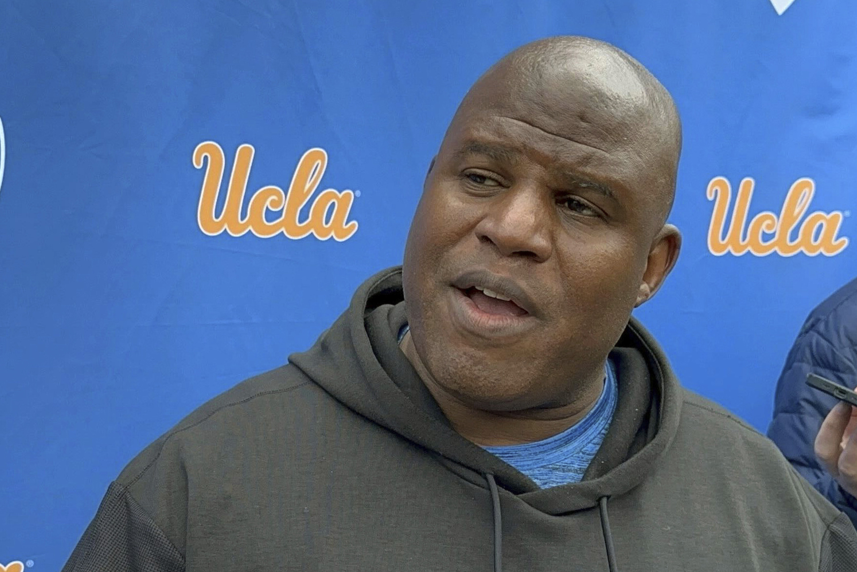 FILE -- UCLA associate head coach and offensive coordinator Eric Bieniemy speaks with the reporters during an NCAA college football media availability, Thursday, April 4, 2024, in Los Angeles. 