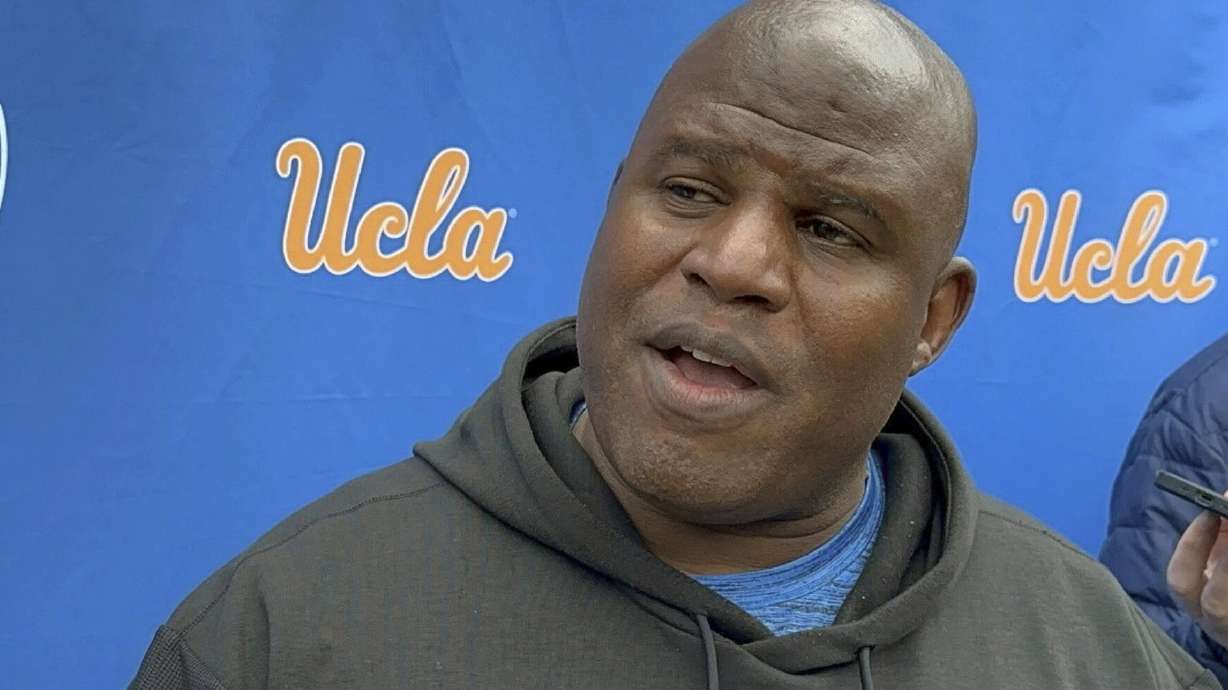 FILE -- UCLA associate head coach and offensive coordinator Eric Bieniemy speaks with the reporters during an NCAA college football media availability, Thursday, April 4, 2024, in Los Angeles.