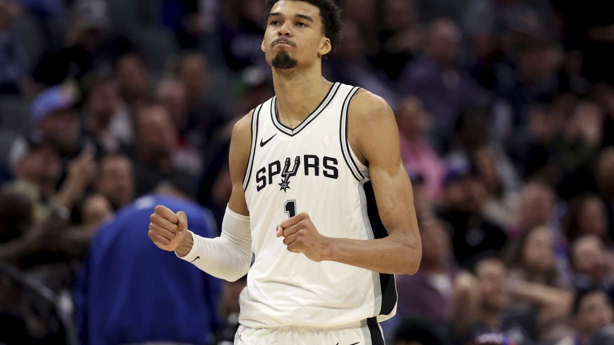 San Antonio Spurs center Victor Wembanyama (1) celebrates after defeating the Sacramento Kings in an NBA basketball game in Sacramento, Calif., Sunday, Dec. 1, 2024.
