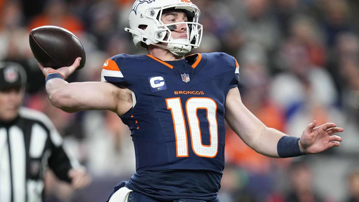 Denver Broncos quarterback Bo Nix throws during the first half of an NFL football game against the Cleveland Browns, Monday, Dec. 2, 2024, in Denver.