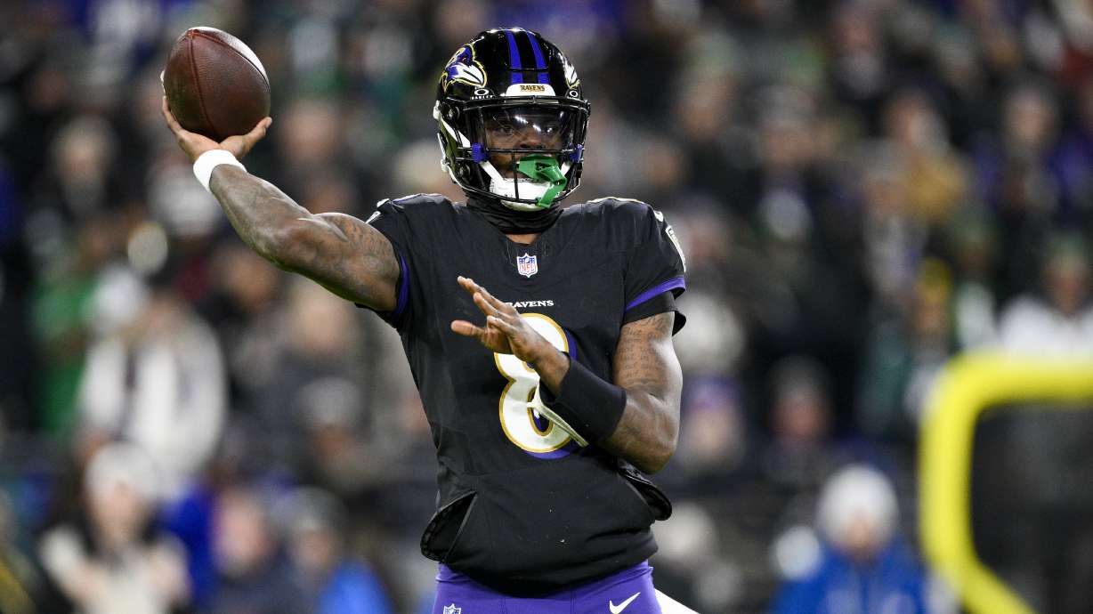 Baltimore Ravens quarterback Lamar Jackson throws a pass against the Philadelphia Eagles during the first half of an NFL football game, Sunday, Dec. 1, 2024, in Baltimore.