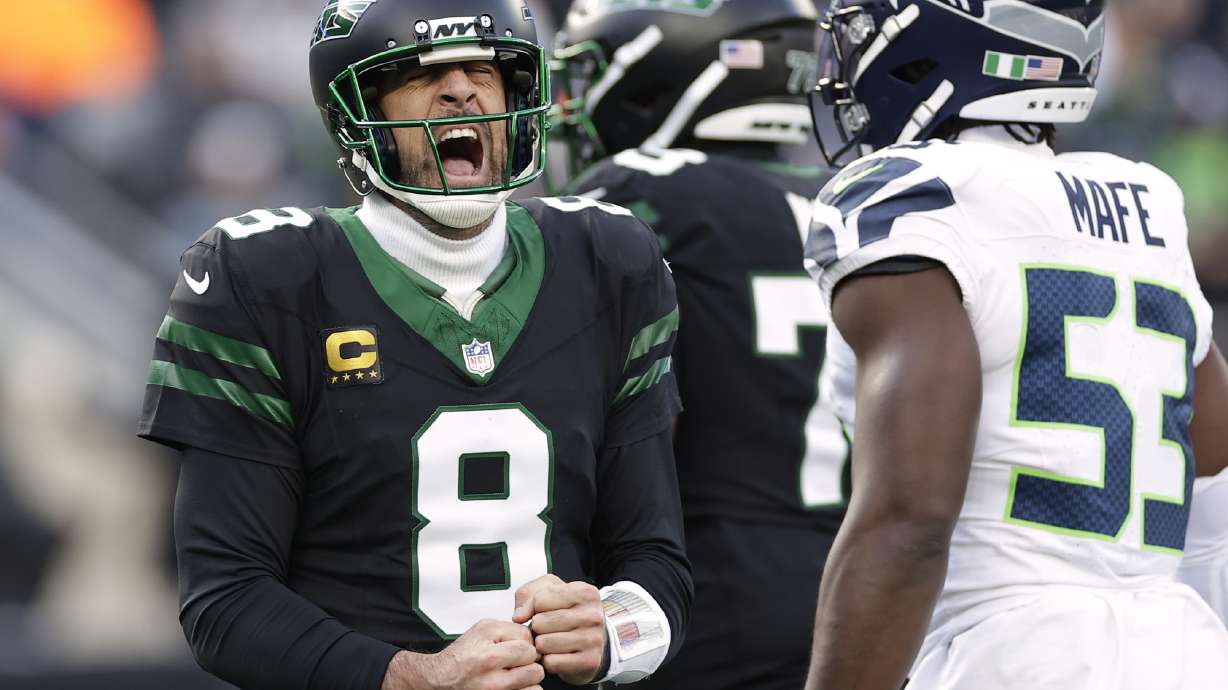 New York Jets quarterback Aaron Rodgers (8) reacts after overthrowing a pass against the Seattle Seahawks during the second quarter of an NFL football game, Sunday, Dec. 1, 2024, in East Rutherford, N.J.