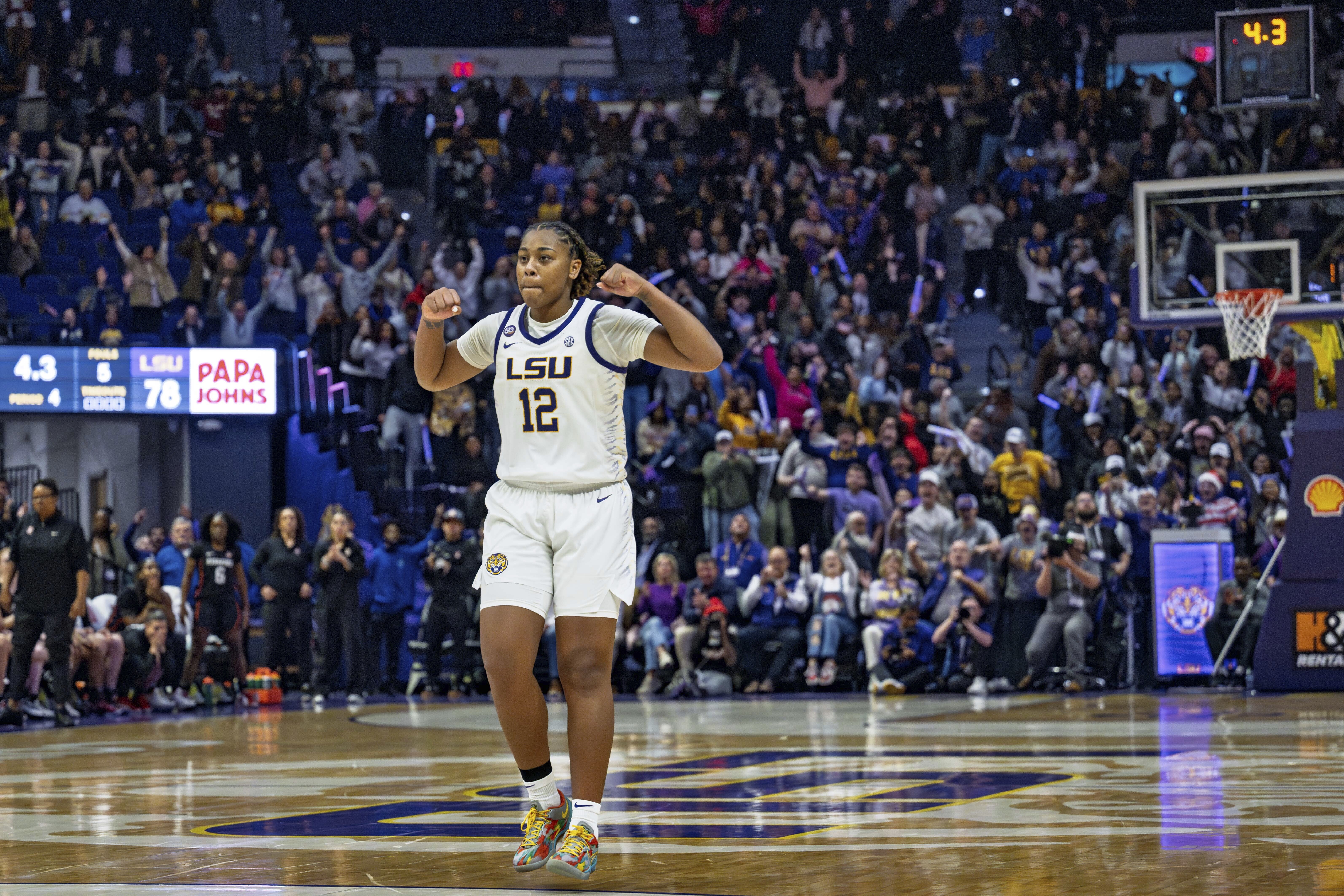 LSU guard Mikaylah Williams (12) celebrates after a jumper late in the fourth quarter to send an NCAA college basketball game against Stanford into overtime Thursday, Dec. 5, 2024, in Baton Rouge, La.