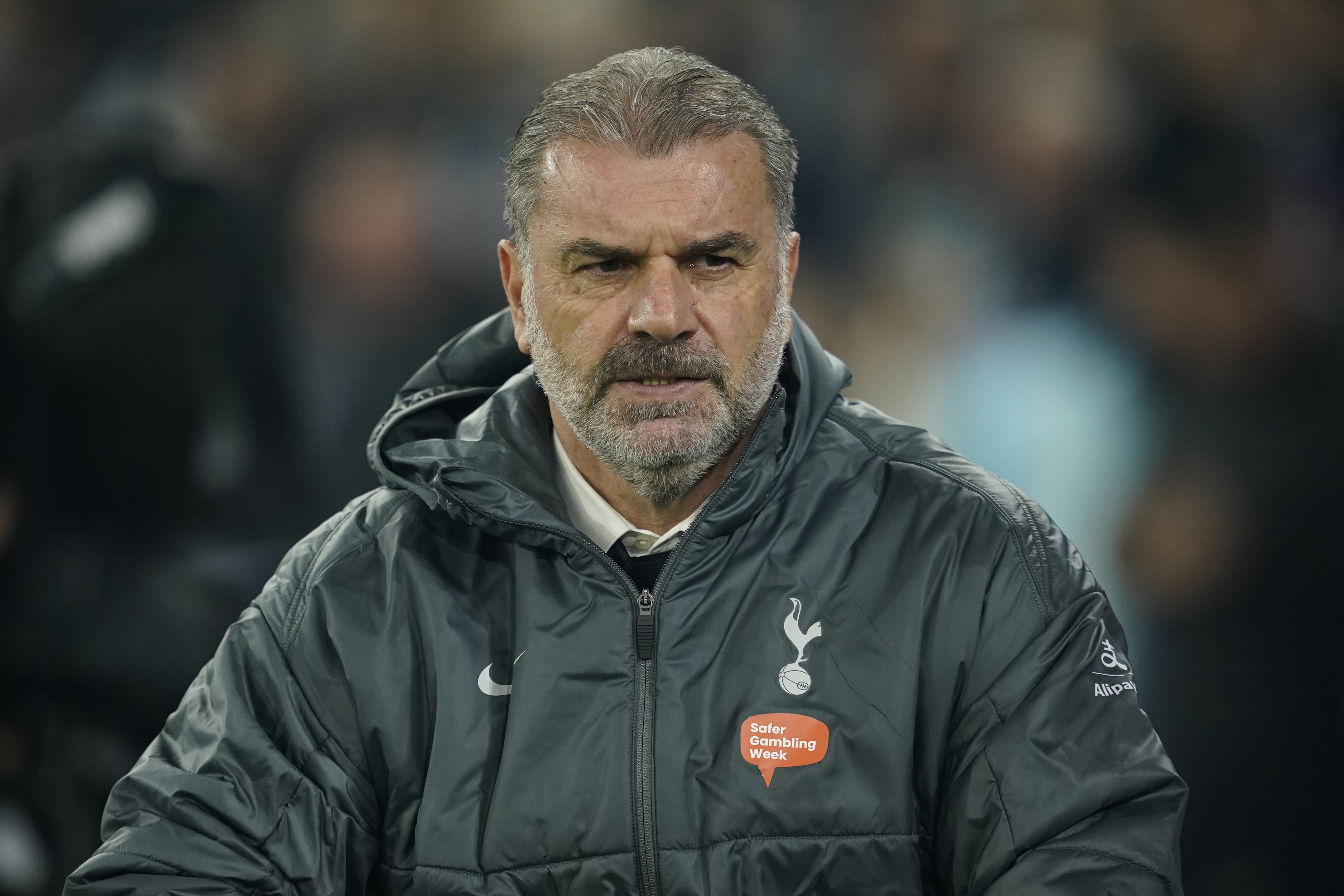 Tottenham's head coach Ange Postecoglou waits for the start of the English Premier League soccer match between Manchester City and Tottenham at the Etihad Stadium in Manchester, England, Sunday, Nov. 24, 2024.