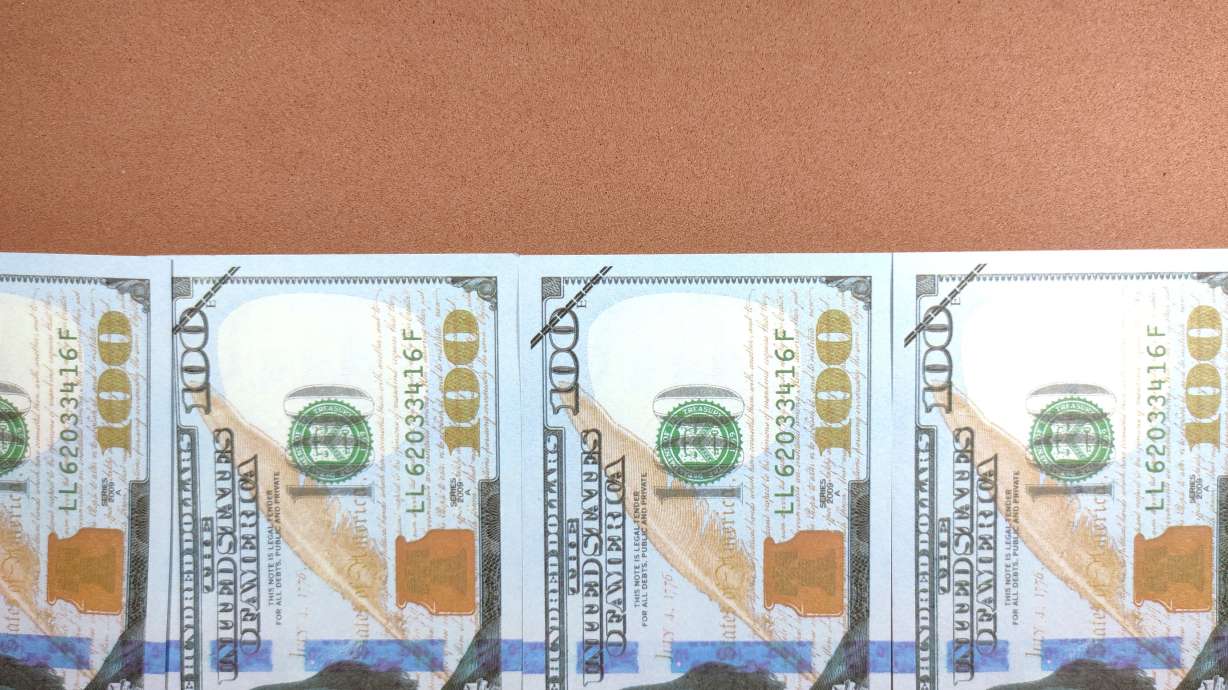 A Utah County woman was charged Thursday with trying to pay thousands of dollars for a remodeling project with fake money she bought on Amazon.