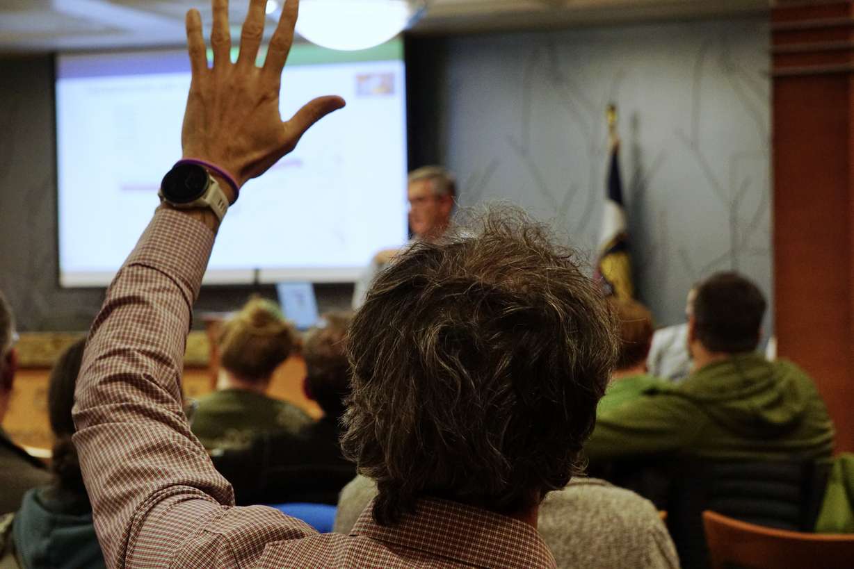 A Logan resident raises his hand during an information session Thursday on a controversial pipeline project along Canyon Road.