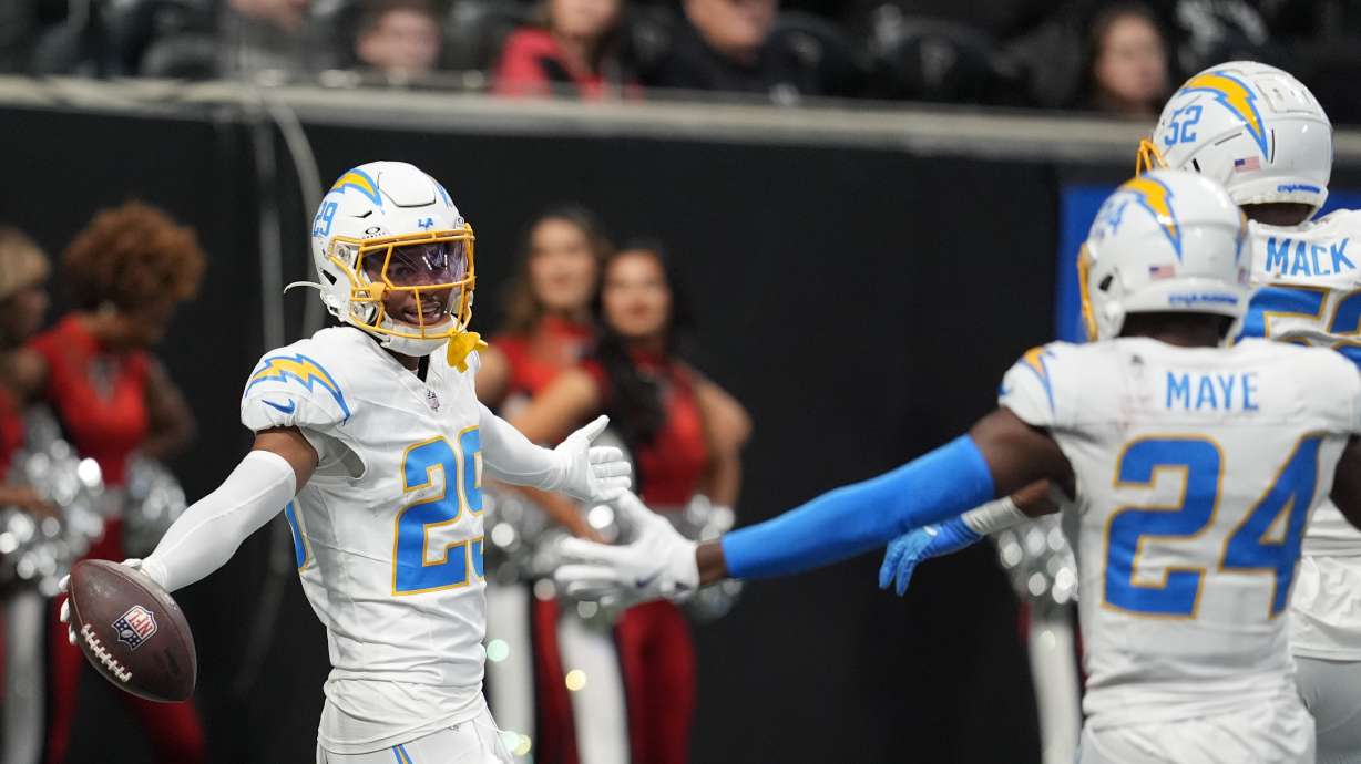 Los Angeles Chargers cornerback Tarheeb Still (29) celebrates after a pick six during the second half of an NFL football game against the Atlanta Falcons on Sunday, Dec. 1, 2024 in Atlanta.