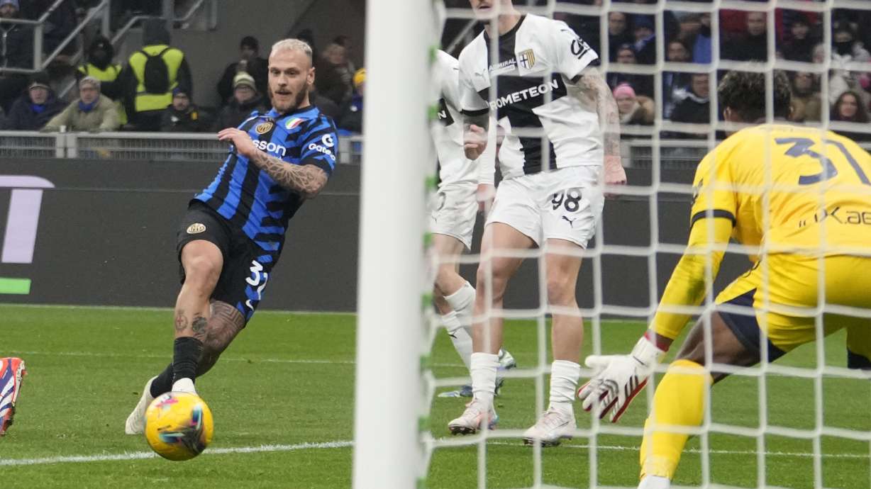 Inter Milan's Federico Dimarco scores during the Serie A soccer match between Inter Milan and Parma at the San Siro stadium in Milan, Italy, Friday, Dec.6, 2024.