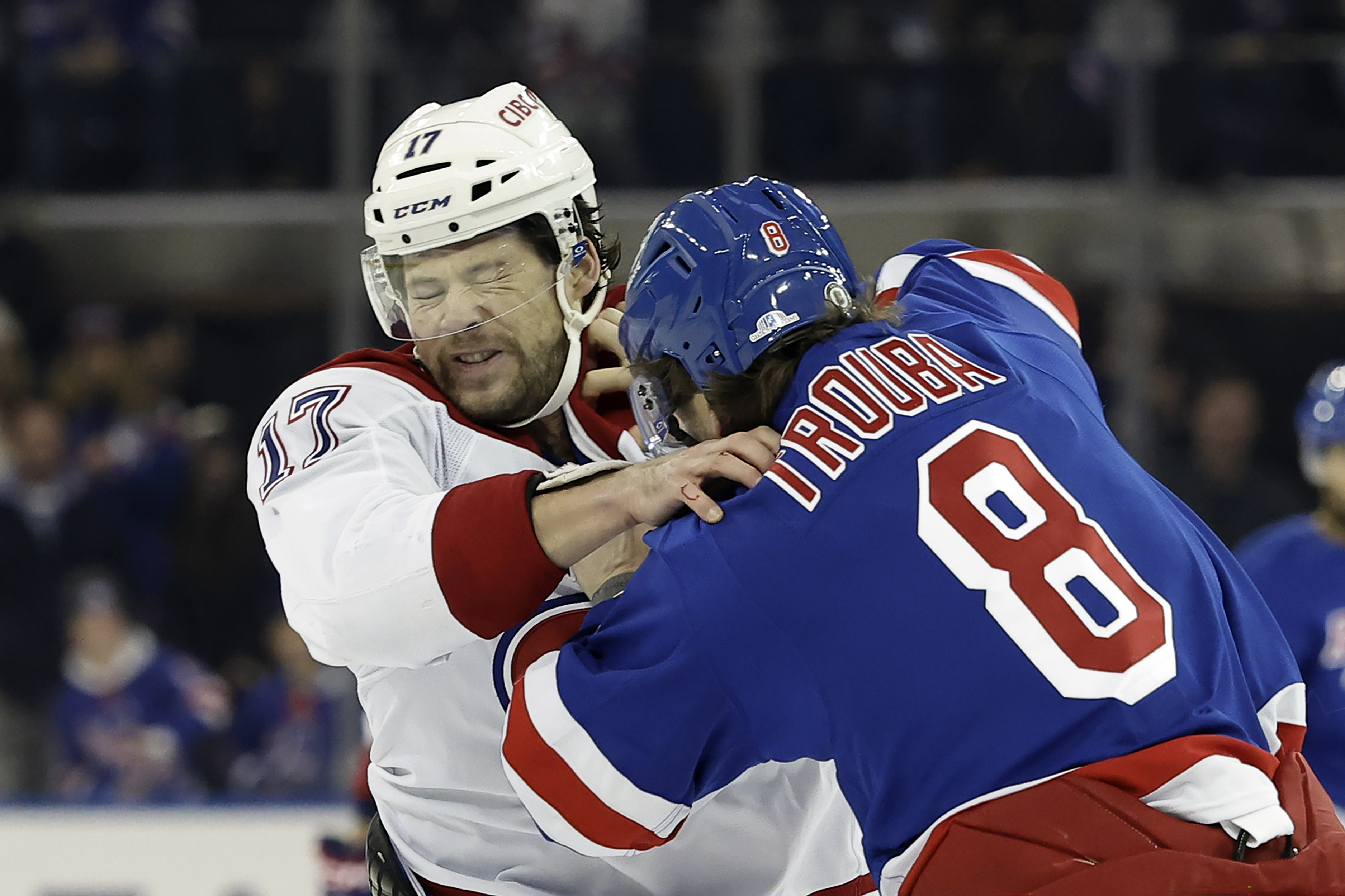 Montreal Canadiens right wing Josh Anderson (17) fights New York Rangers defenseman Jacob Trouba in the first period of an NHL hockey game Saturday, Nov. 30, 2024, in New York.