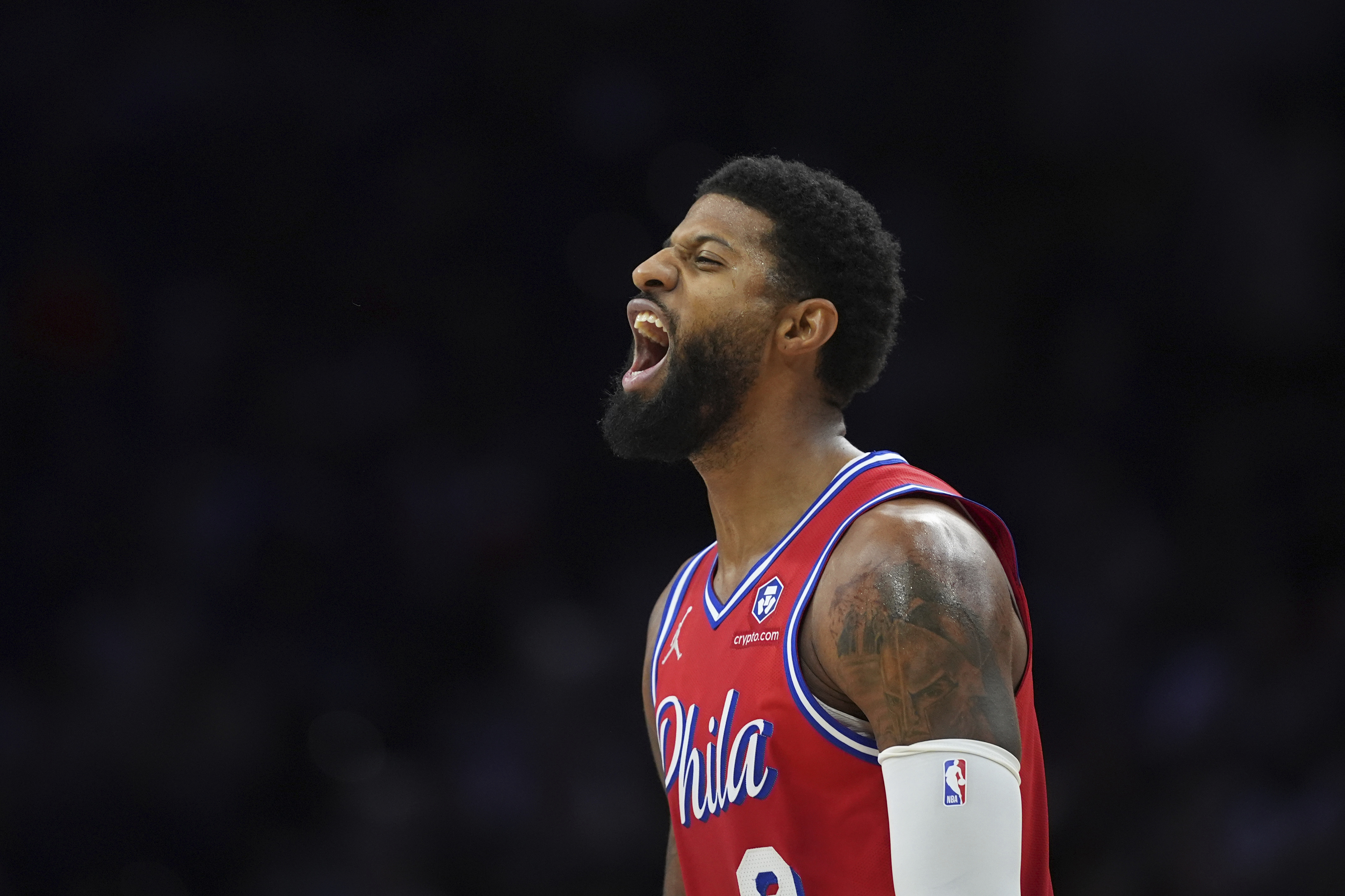 Philadelphia 76ers' Paul George reacts after scoring during the first half of an NBA basketball game against the Orlando Magic, Friday, Dec. 6, 2024, in Philadelphia.