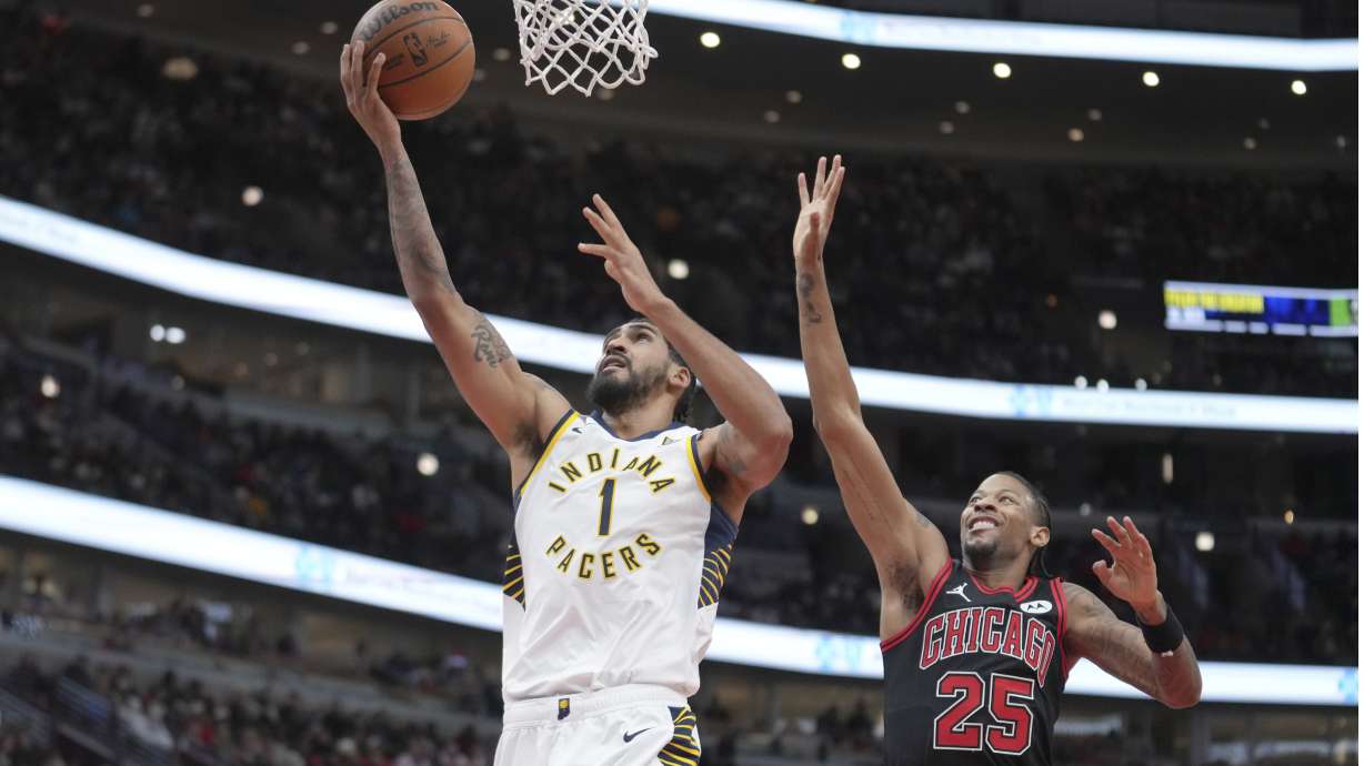 Indiana Pacers' Obi Toppin scores past Chicago Bulls' Dalen Terry during the second half of an NBA basketball game Friday, Dec. 6, 2024, in Chicago.