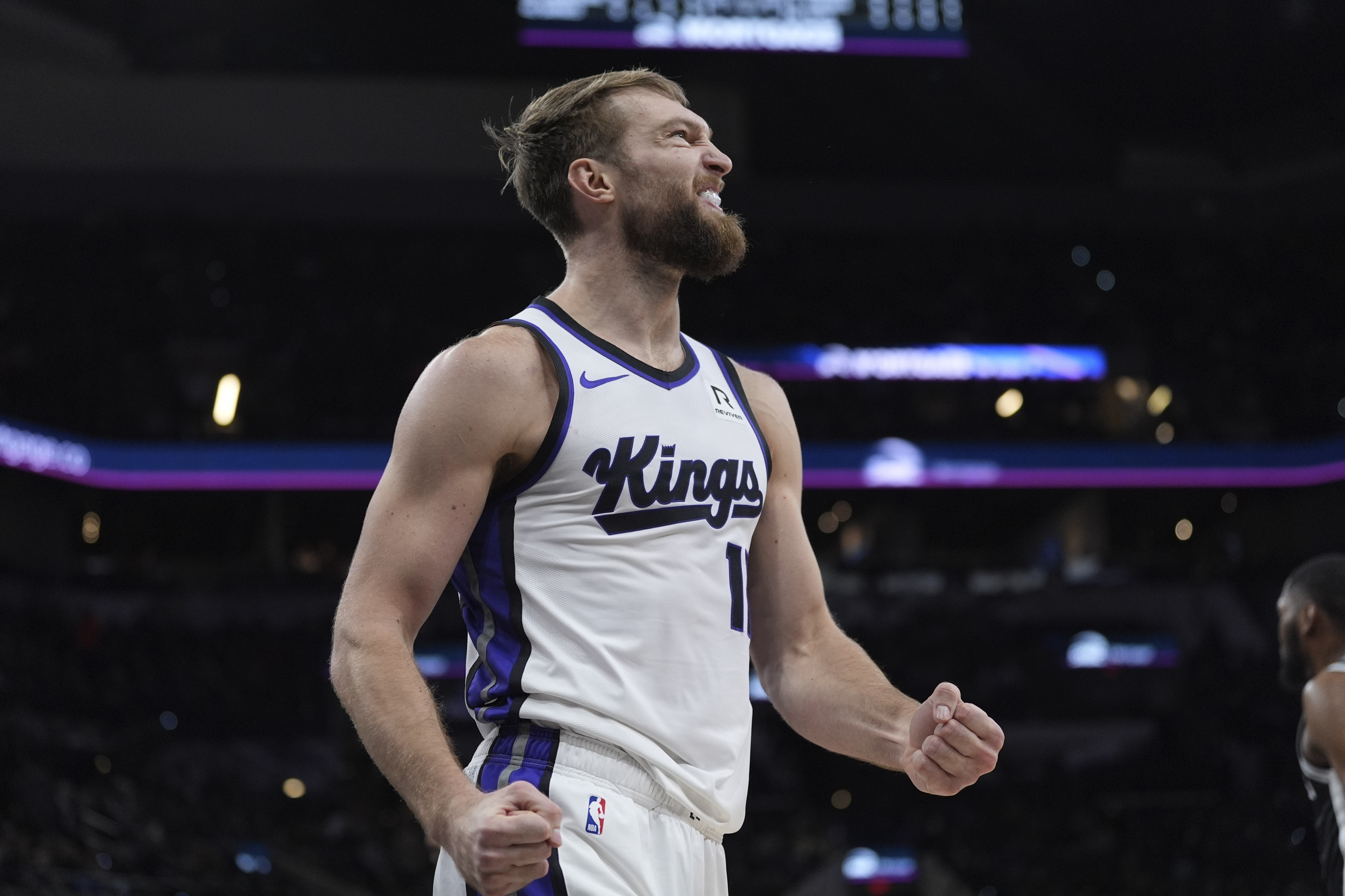 Sacramento Kings forward Domantas Sabonis (11) reacts to a play during the first half of an NBA basketball game against the San Antonio Spurs in San Antonio, Friday, Dec. 6, 2024.