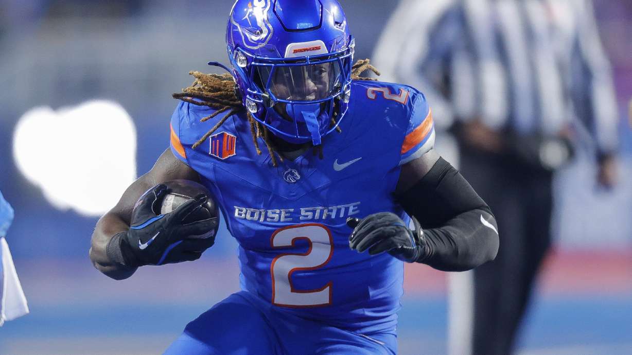 Boise State running back Ashton Jeanty (2) runs with the ball against UNLV in the first half of the Mountain West Championship NCAA college football game Friday, Dec. 6, 2024, in Boise, Idaho.