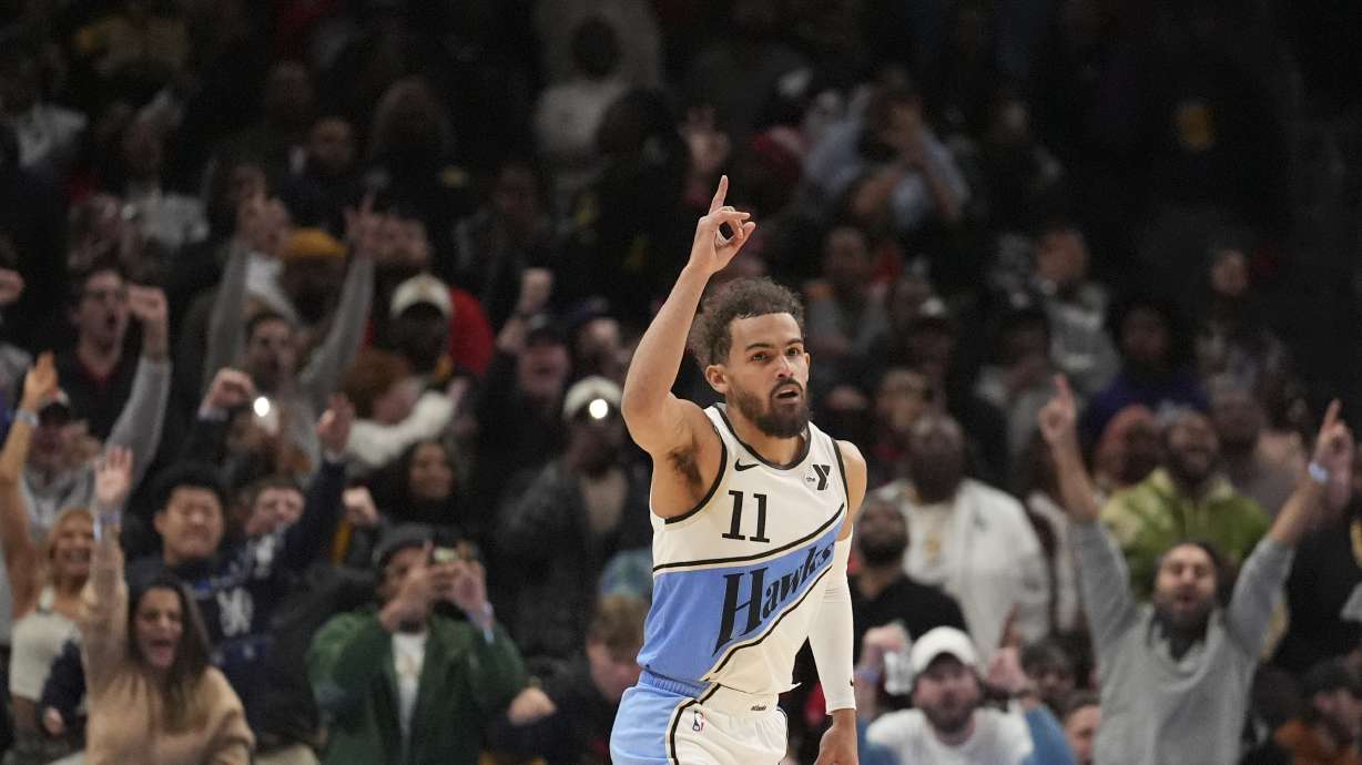 Atlanta Hawks guard Trae Young (11) celebrates after he scores, winning an NBA basketball game against the Los Angeles Lakers, Friday, Dec. 6, 2024, in Atlanta.