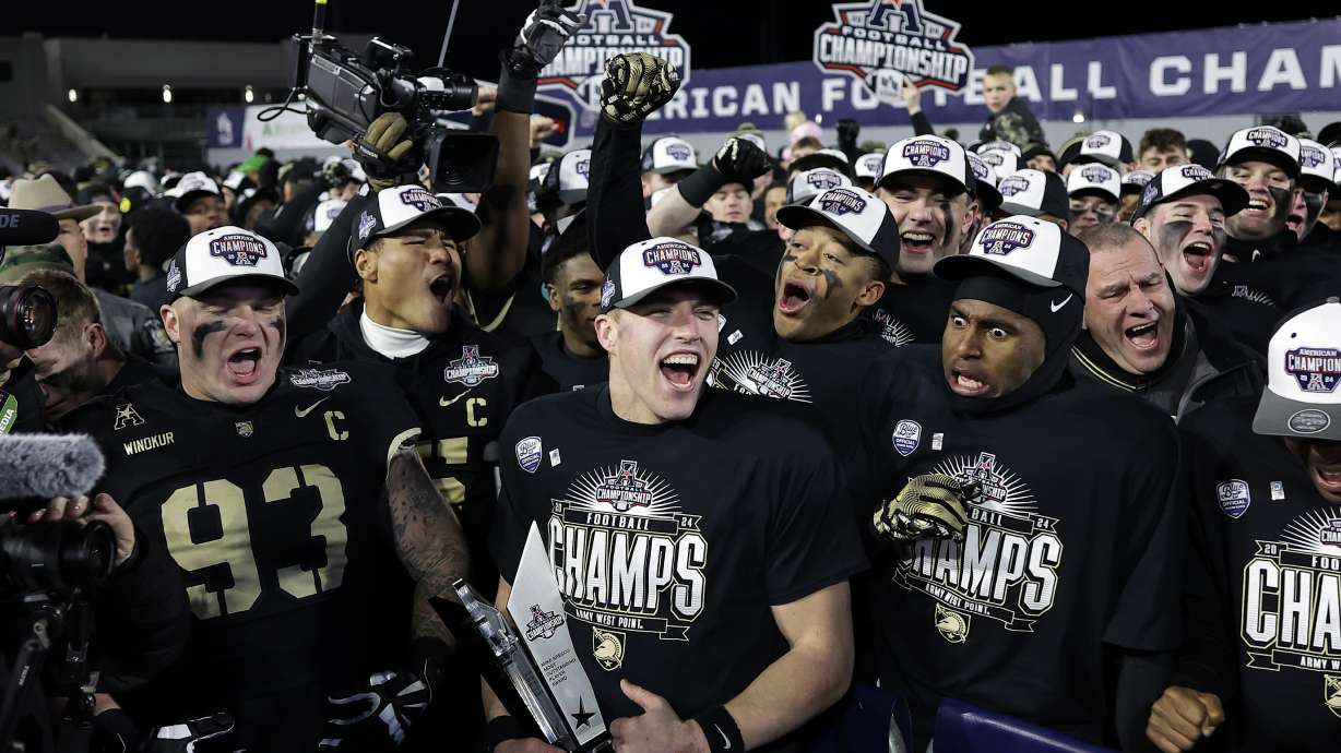 Army quarterback Bryson Daily, second left, celebrates with teammates after the American Athletic Conference championship NCAA college football game against Tulane Friday, Dec. 6, 2024, in West Point, N.Y. Army won 35-14.