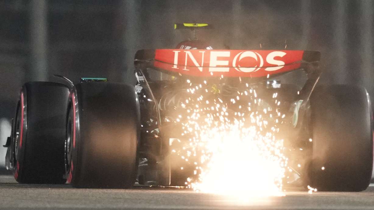 Mercedes driver Lewis Hamilton of Britain creates sparks as his car touches the track during the qualifying for the Formula One Abu Dhabi Grand Prix at the Yas Marina Circuit in Abu Dhabi, UAE, Saturday, Dec. 7, 2024.