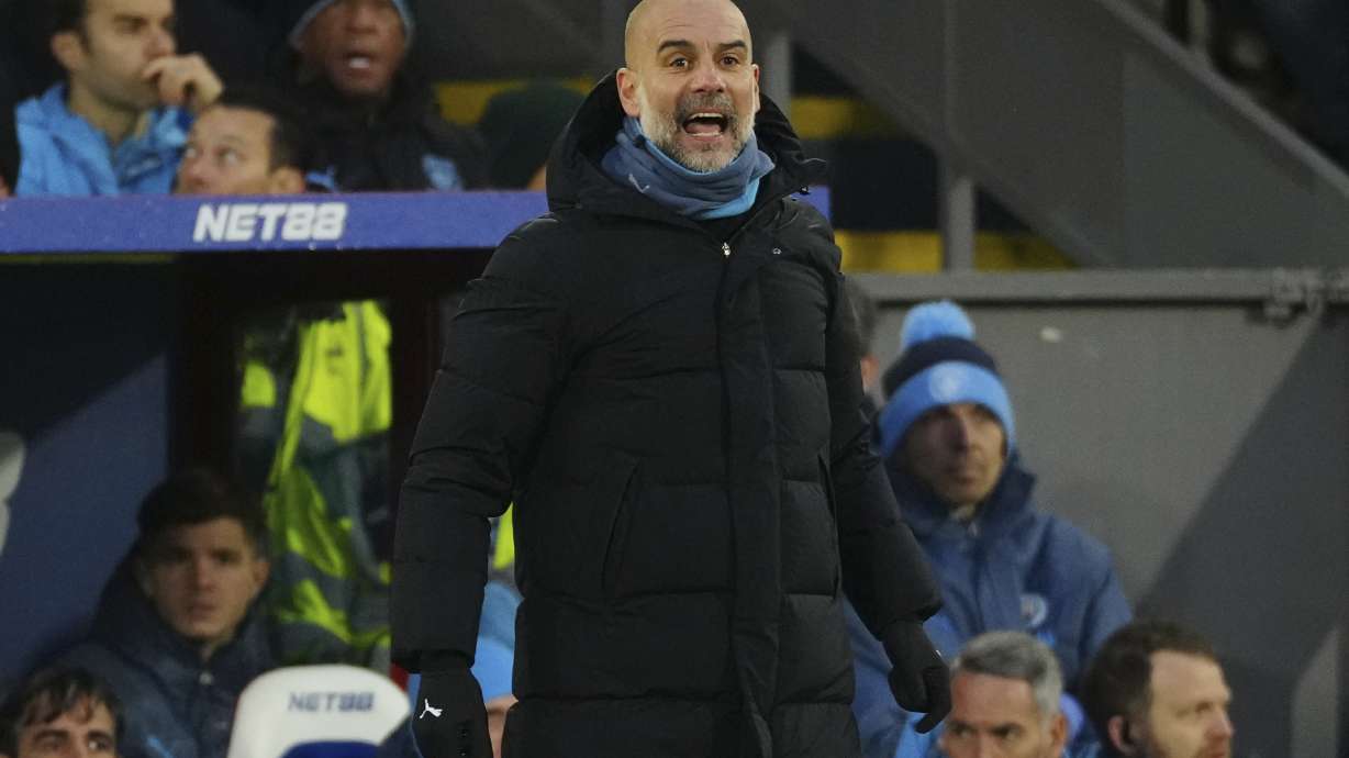 Manchester City's head coach Pep Guardiola reacts during the English Premier League soccer match between Crystal Palace and Manchester City at Selhurst Park in London, Saturday Dec. 7, 2024.