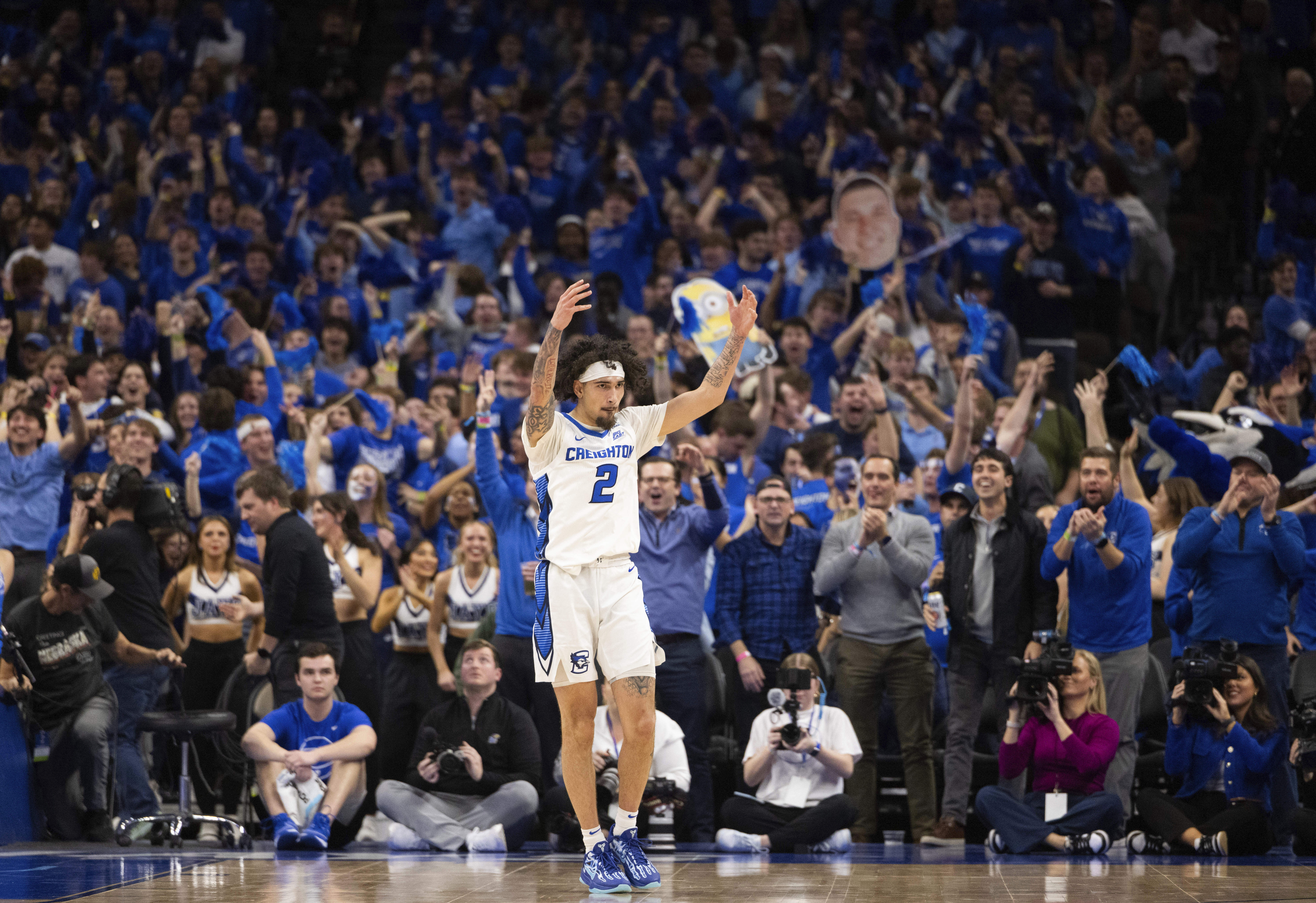 Creighton's Pop Isaacs (2) celebrates after scoring a three pointer against Kansas during the second half of an NCAA college basketball game Wednesday, Dec. 4, 2024, in Omaha, Neb. Creighton defeated Kansas 76-63.
