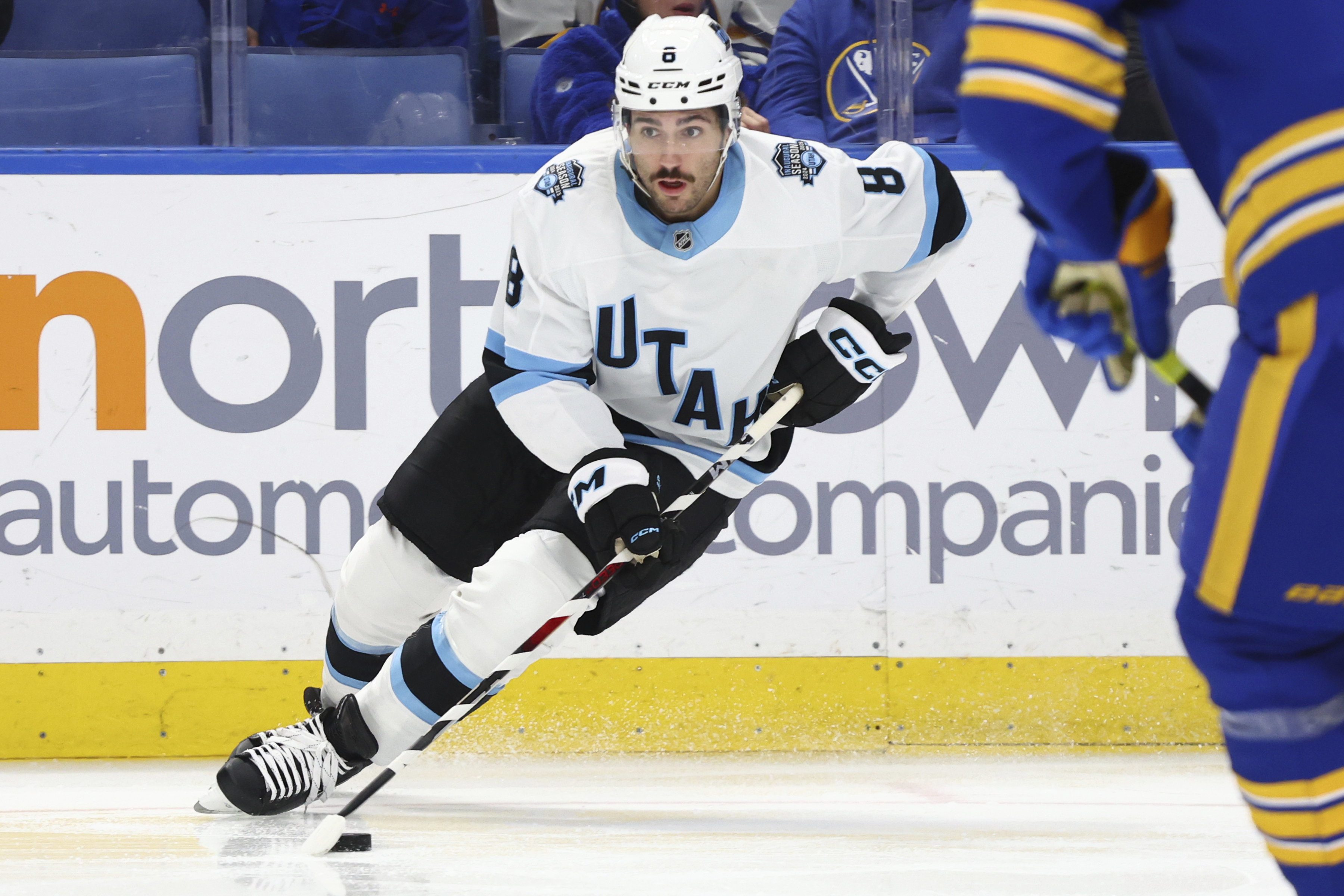 Utah Hockey Club center Nick Schmaltz (8) controls the puck during the second period of an NHL hockey game against the Buffalo Sabres, Saturday, Dec. 7, 2024, in Buffalo, N.Y.