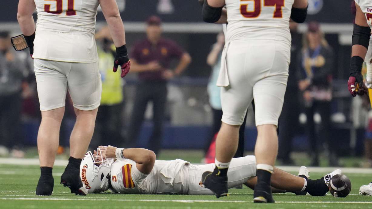 Iowa State quarterback Rocco Becht (3) grabs his helmet after taking a hit in the second half of the Big 12 Conference championship NCAA college football game against Arizona State, in Arlington, Texas, Saturday Dec. 7, 2024.