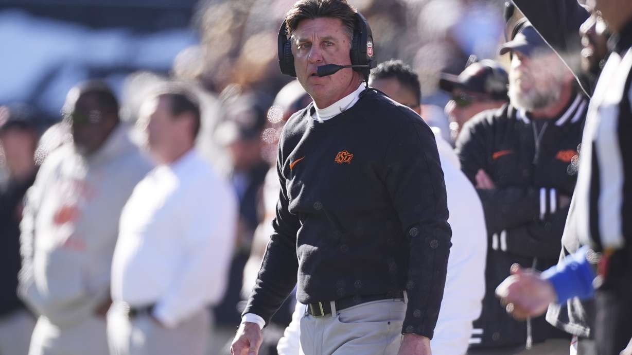 FILE -Oklahoma State head coach Mike Gundy in the first half of an NCAA college football game Friday, Nov. 29, 2024, in Boulder, Colo.