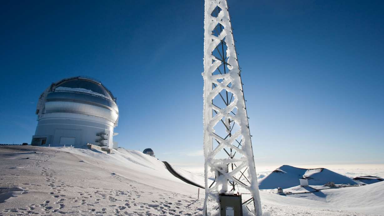 A radio tower next to the Canada France Telescope is covered in ice at the summit of Mauna Kea on the Big Island of Hawaii.