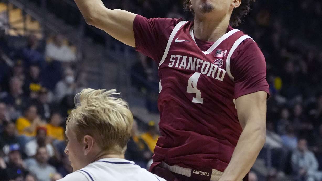 Stanford guard Oziyah Sellers, top, goes up to shoot against California forward Rytis Petraitis (31) during the second half of an NCAA college basketball game in Berkeley, Calif., Saturday, Dec. 7, 2024.
