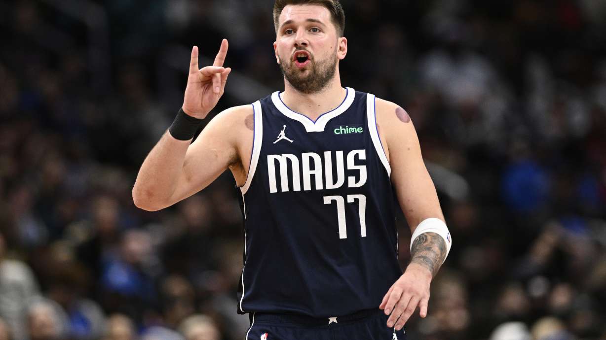 Dallas Mavericks guard Luka Doncic (77) gestures during the second half of an NBA basketball game against the Washington Wizards, Thursday, Dec. 5, 2024, in Washington. The Mavericks won 137-101.
