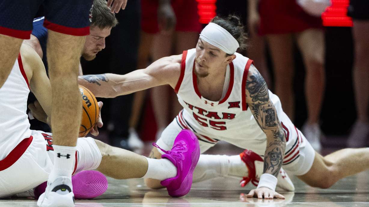 Utah Utes guard Gabe Madsen (55) grabbles for the ball during a game against the St. Mary's Gaels at the Jon M. Huntsman Center on the campus of the University of Utah in Salt Lake City on Saturday, Dec. 7, 2024.