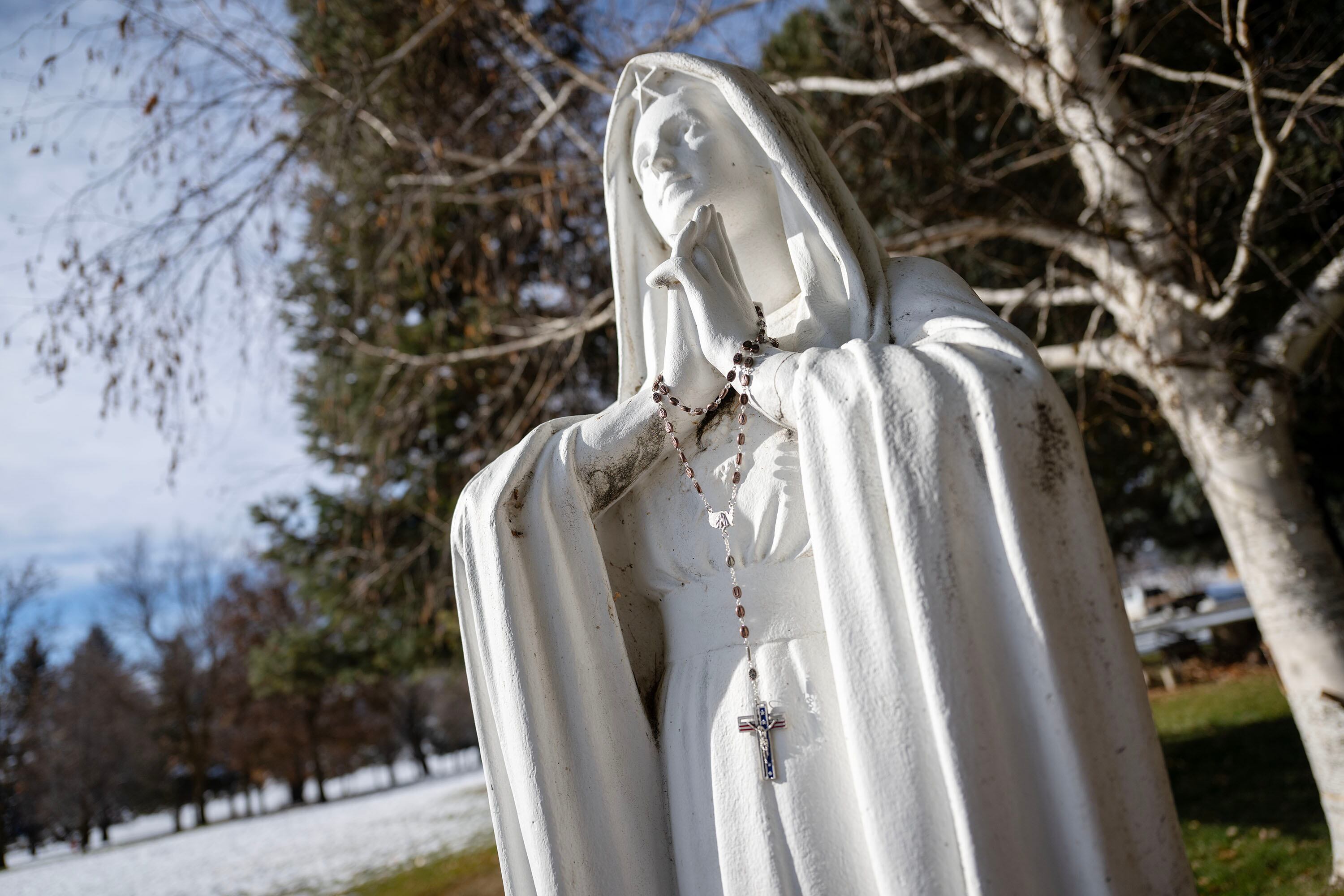 A statue of “Our Lady of Confidence” sits adjacent to a small cemetery at the Historic Monastery Farm in Huntsville, Nov. 25.