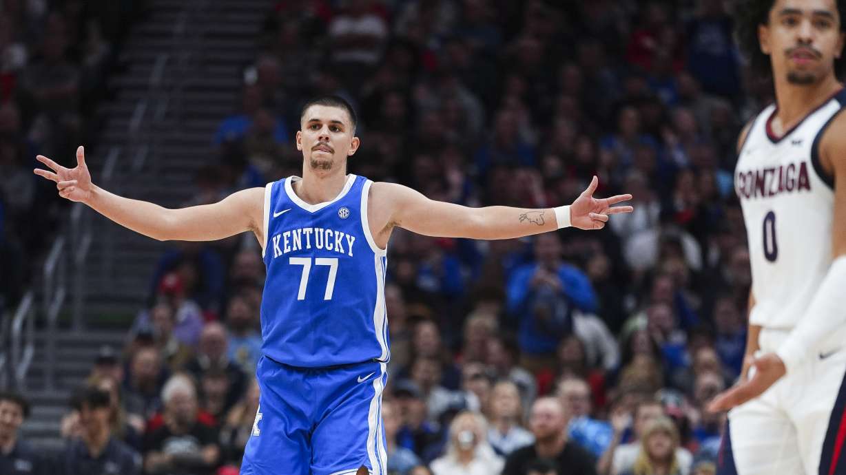 Kentucky guard Kerr Kriisa (77) reacts after making a three-point basket against Gonzaga during the first half of an NCAA college basketball game Saturday, Dec. 7, 2024, in Seattle.