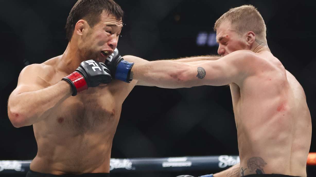 Shavkat Rakhmonov, right, punches Ian Machado Garry in a UFC 310 mixed martial arts welterweight bout at T-Mobile Arena, Saturday, Dec. 7, 2024, in Las Vegas.
