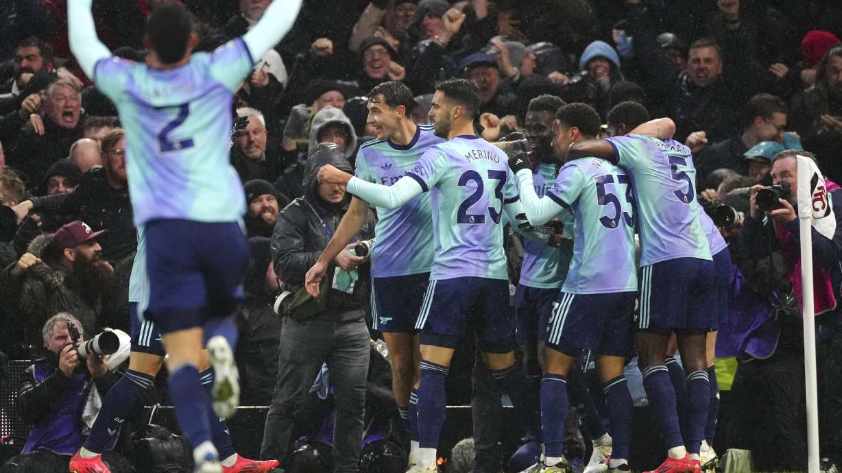 Arsenal players celebrate a goal that was later disallowed during the English Premier League soccer match between Fulham and Arsenal, at the Craven Cottage Stadium in London, Sunday, Dec. 8, 2024.
