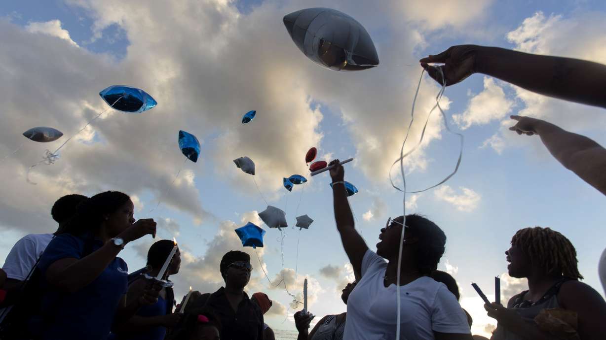Mourners release balloons at a vigil for a police officer in New Orleans in June 2015. New Orleans, known for its celebrations and festive spirit, is now banning the release of metallic balloons.
