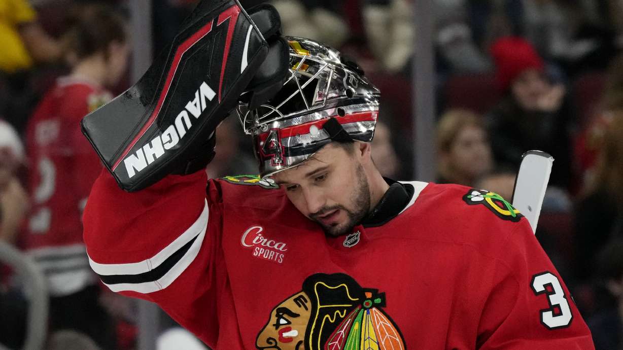 Chicago Blackhawks goaltender Petr Mrazek reacts after Columbus Blue Jackets center Sean Monahan scored during the second period of an NHL hockey game in Chicago, Sunday, Dec.1, 2024.