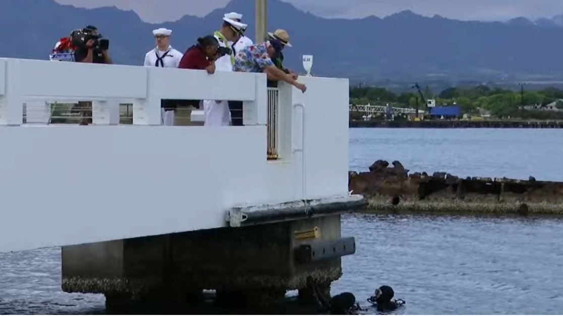 A Navy sailor who survived the Pearl Harbor attack on Dec. 7, 1941 was laid to rest and reunited with his fallen shipmates inside the sunken USS Utah on Friday.
