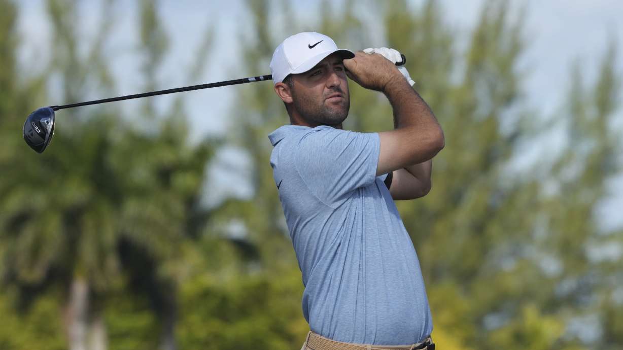 Scottie Scheffler, of the United States, watches his drive on the third hole during the final round of the Hero World Challenge PGA Tour at the Albany Golf Club, in New Providence, Bahamas, Sunday, Dec. 8, 2024.