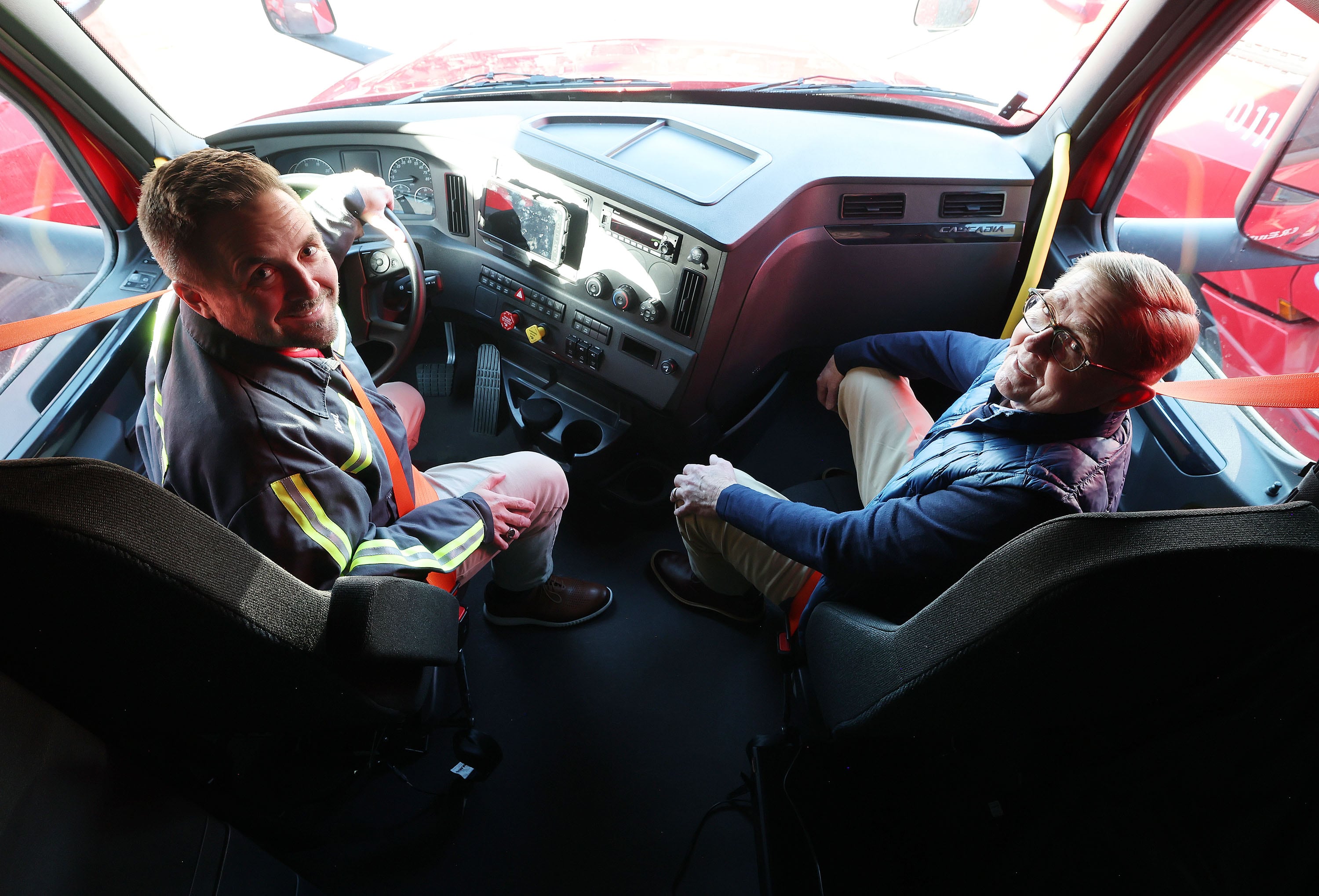 Dan England and his son Chad England, both executives of C.R. England, in West Valley City on Nov. 20. The list of the things Gene England loved in life is a very long one.