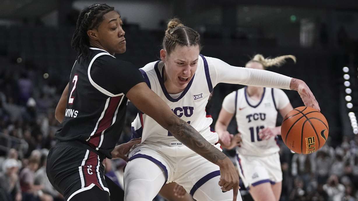 TCU center Sedona Prince, right, works for a shot as South Carolina forward Ashlyn Watkins defends in the first half of an NCAA college basketball game in Fort Worth, Texas, Sunday, Dec. 8, 2024.