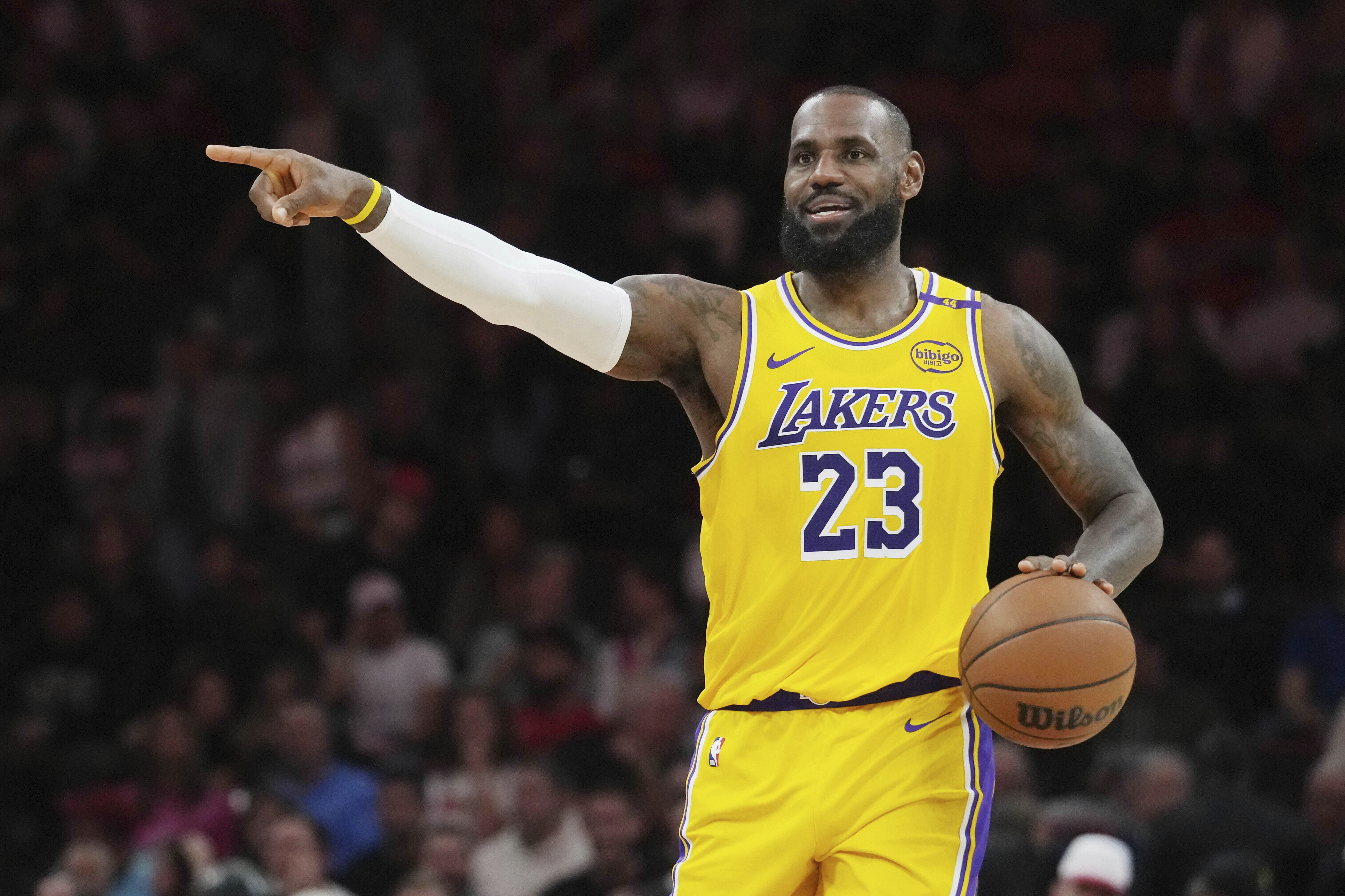 Los Angeles Lakers forward LeBron James gestures during the first half of an NBA basketball game against the Miami Heat, Wednesday, Dec. 4, 2024, in Miami.