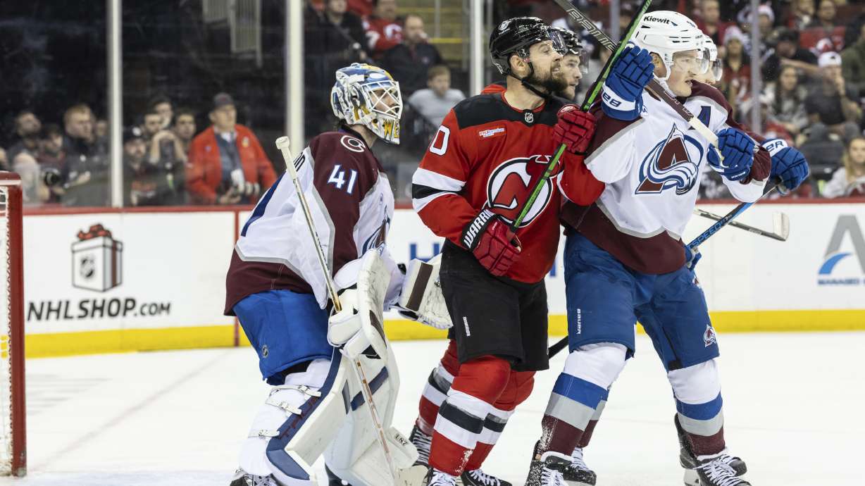 Colorado Avalanche goalie Scott Wedgewood (41) looks out during the second period of an NHL hockey game against the New Jersey Devils, Sunday, Dec. 8, 2024, in Newark, N.J.