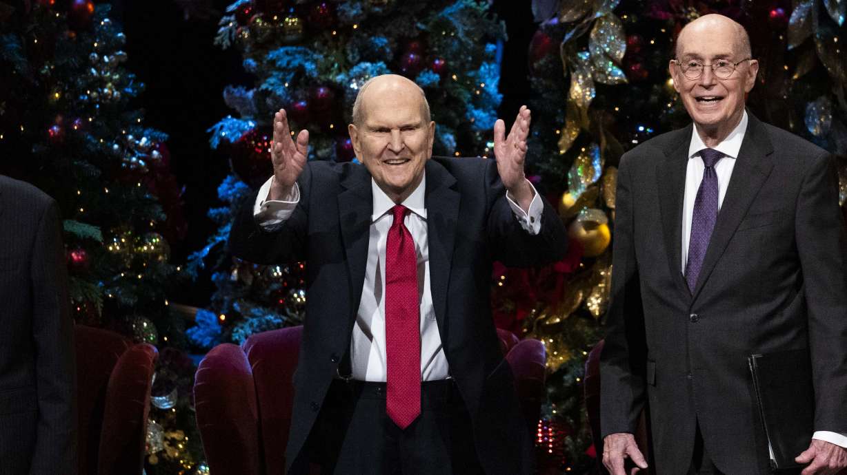 President Russell M. Nelson of The Church of Jesus Christ of Latter-day Saints blows a kiss to audience members during the First Presidency’s Christmas Devotional in Salt Lake City on Sunday.