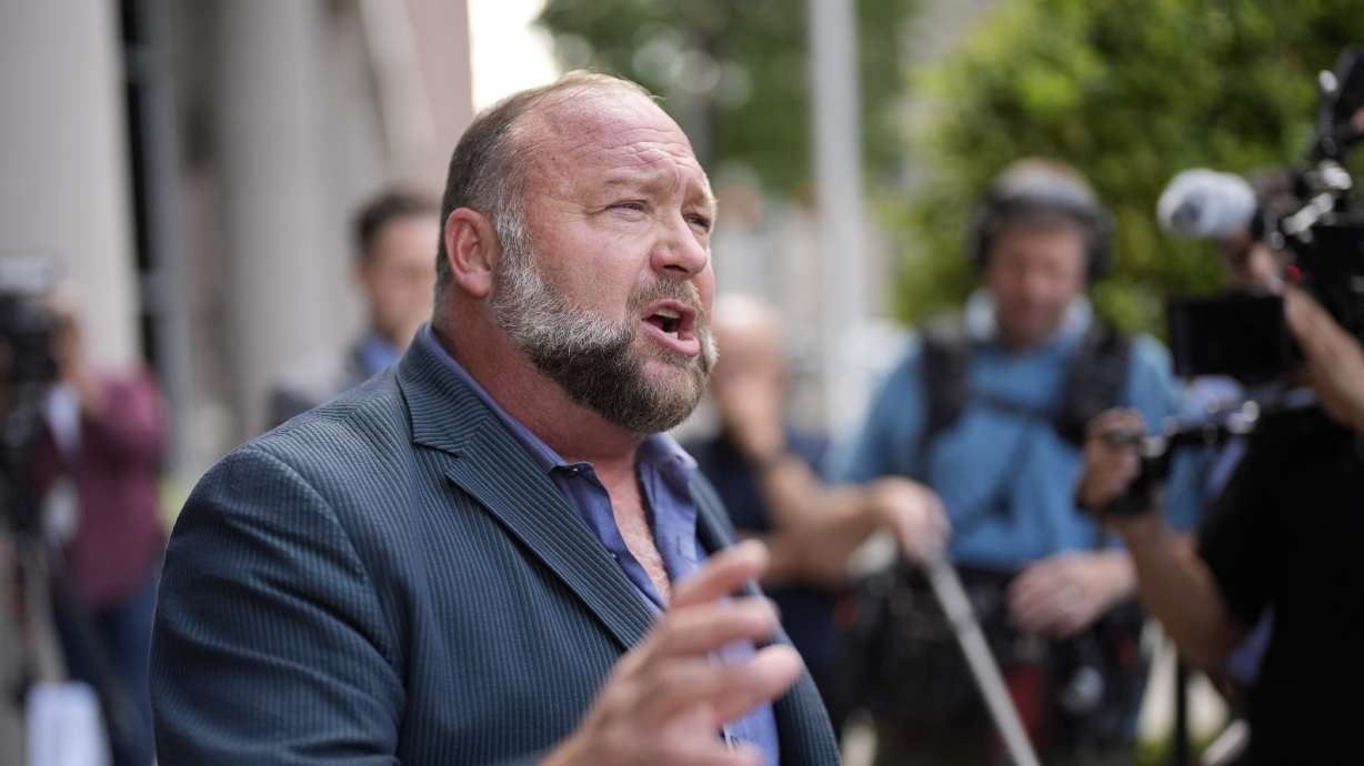 Alex Jones speaks to the media at the federal courthouse June 14 in Houston. The Onion's bid to buy Alex Jones' Infowars has returned to a Texas courtroom.
