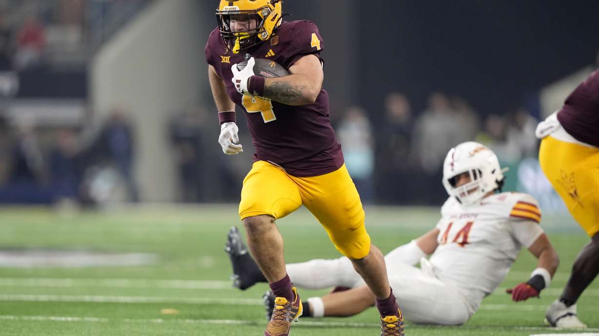 Arizona State running back Cam Skattebo (4) sprints to the end zone for a touchdown in the second half of the Big 12 Conference championship NCAA college football game against Iowa State, in Arlington, Texas, Saturday Dec. 7, 2024.