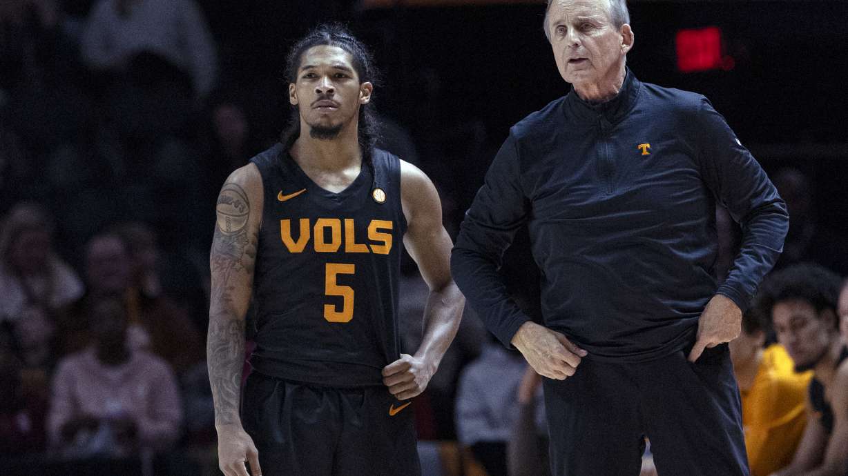Tennessee head coach Rick Barnes talks with Zakai Zeigler during the second half of an NCAA college basketball game against Syracuse, Tuesday, Dec. 3, 2024, in Knoxville, Tenn.